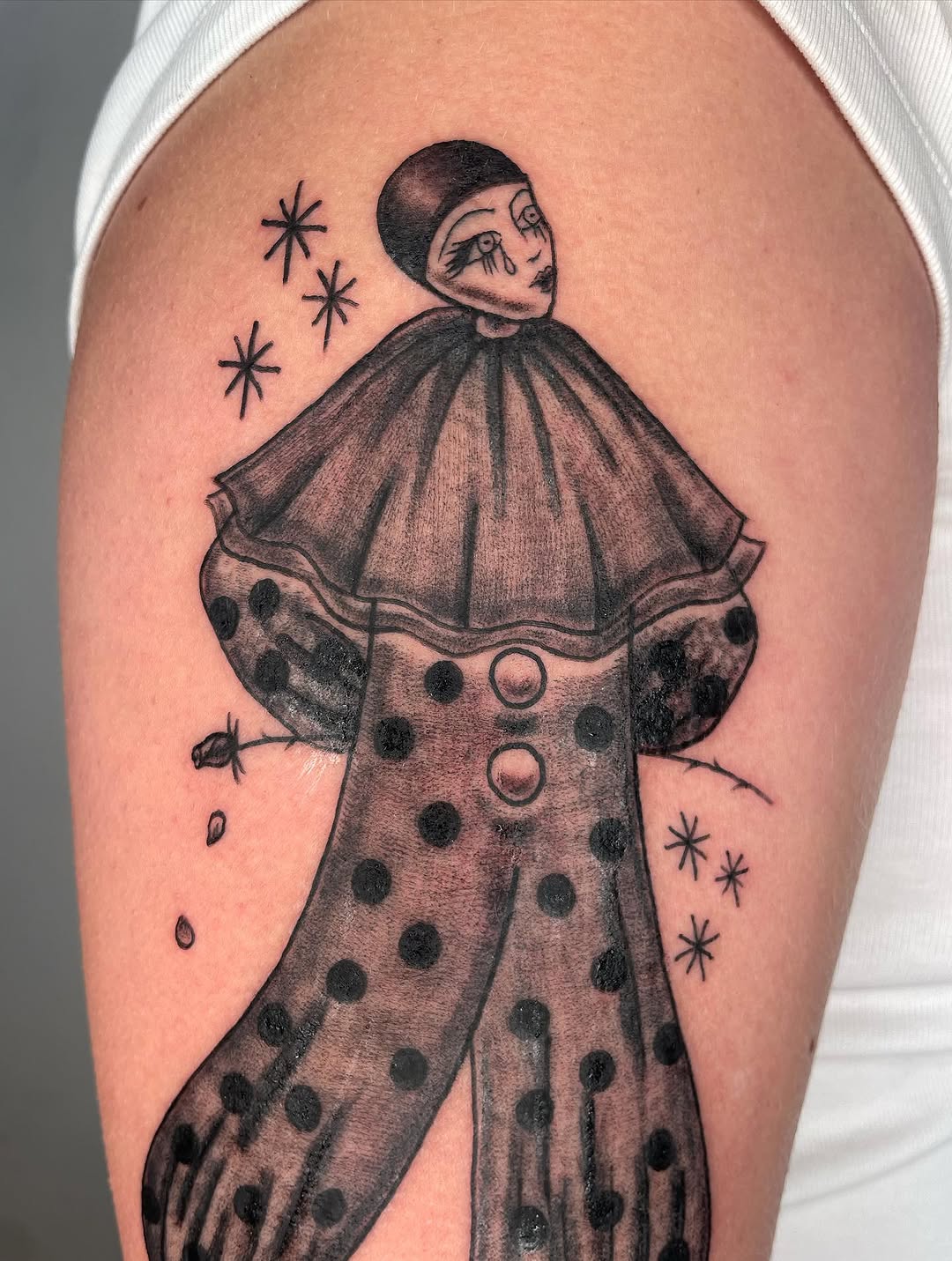Sad clown with polka dots dotwork tattoo on the thigh by Fin :