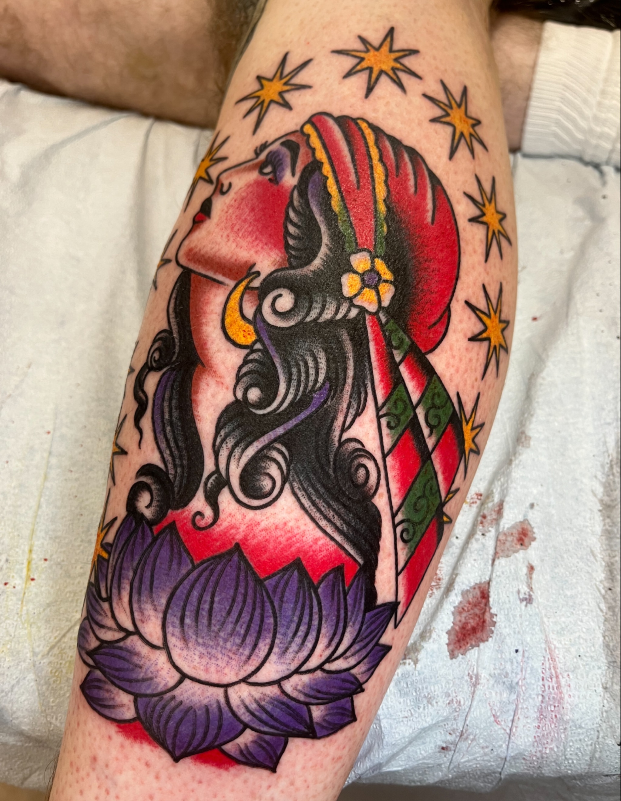 Woman with lotus American traditional tattoo on the forearm by Tim Howell