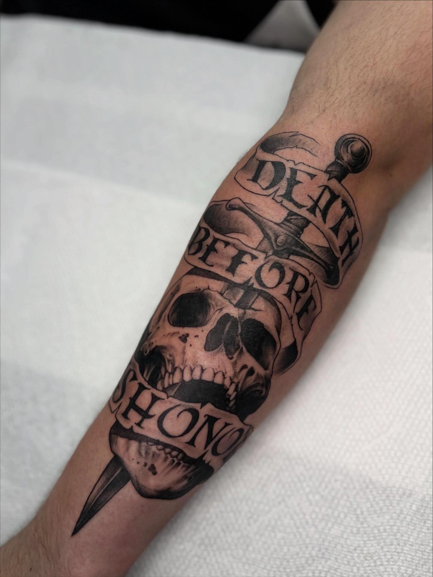 Death before dishonor realism tattoo on the forearm by Tattoos by Tessa