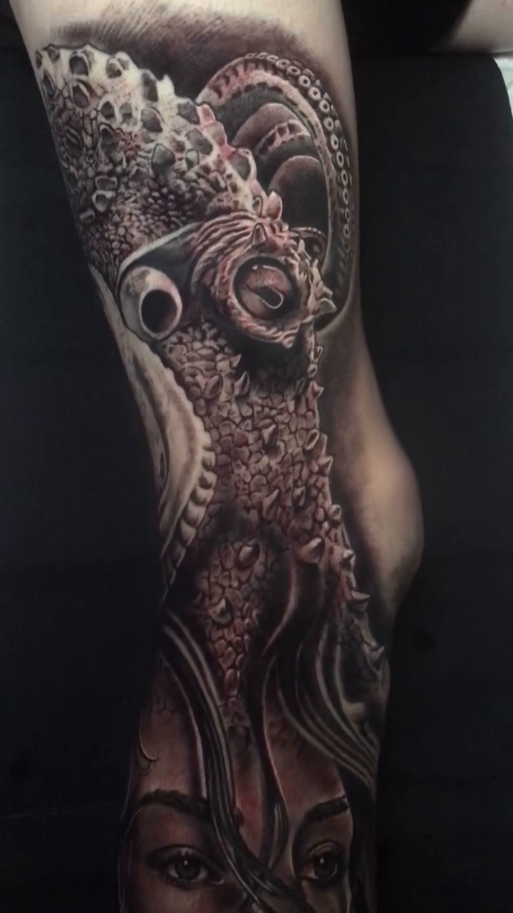 Biomechanical woman with tentacles realism tattoo by Jose Calderon