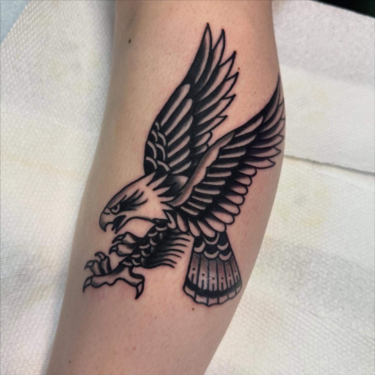 Eagle black and grey tattoo on the forearm by Shana