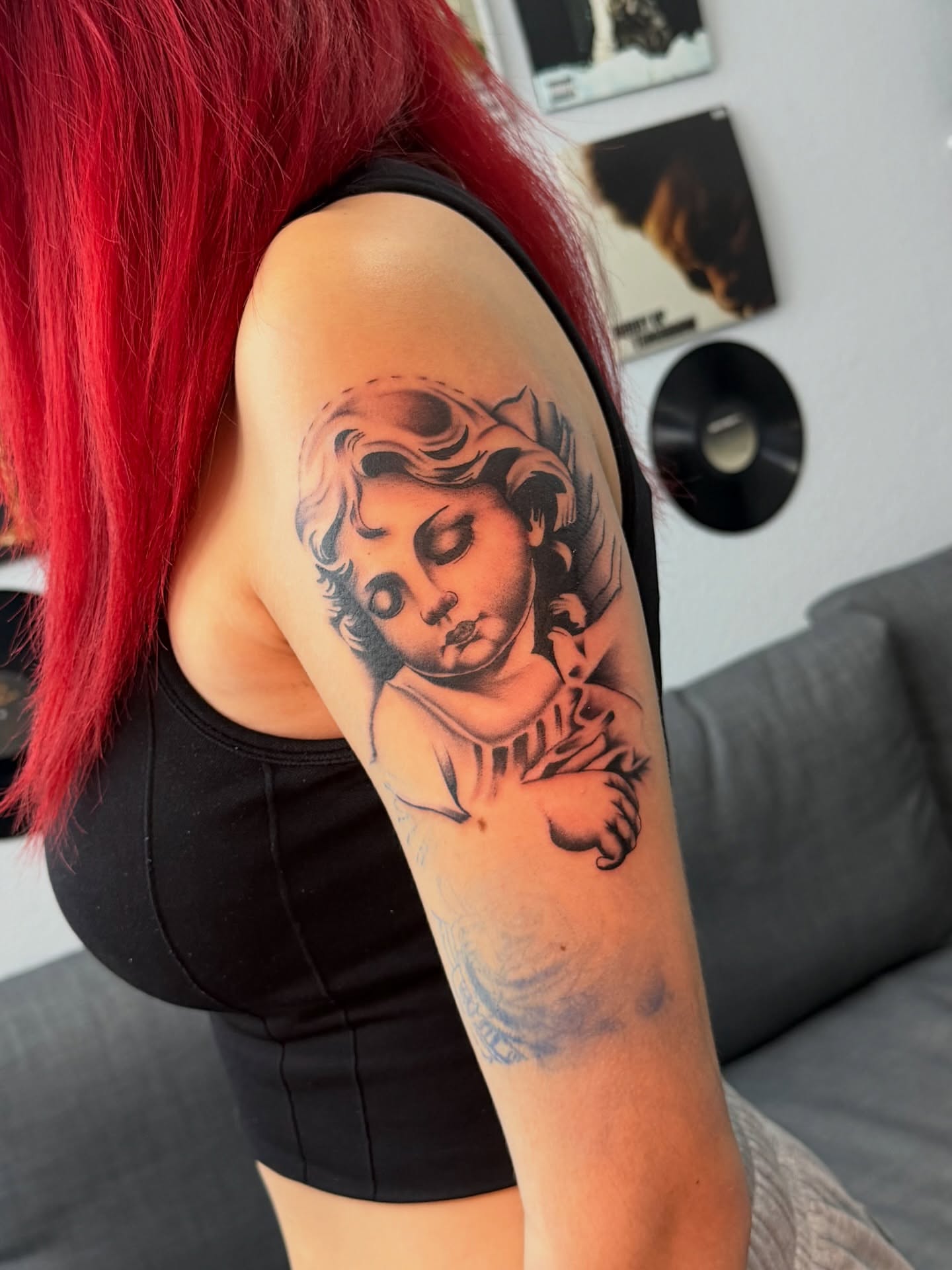 Cherub black and grey tattoo on the shoulder by InkbyCasillas