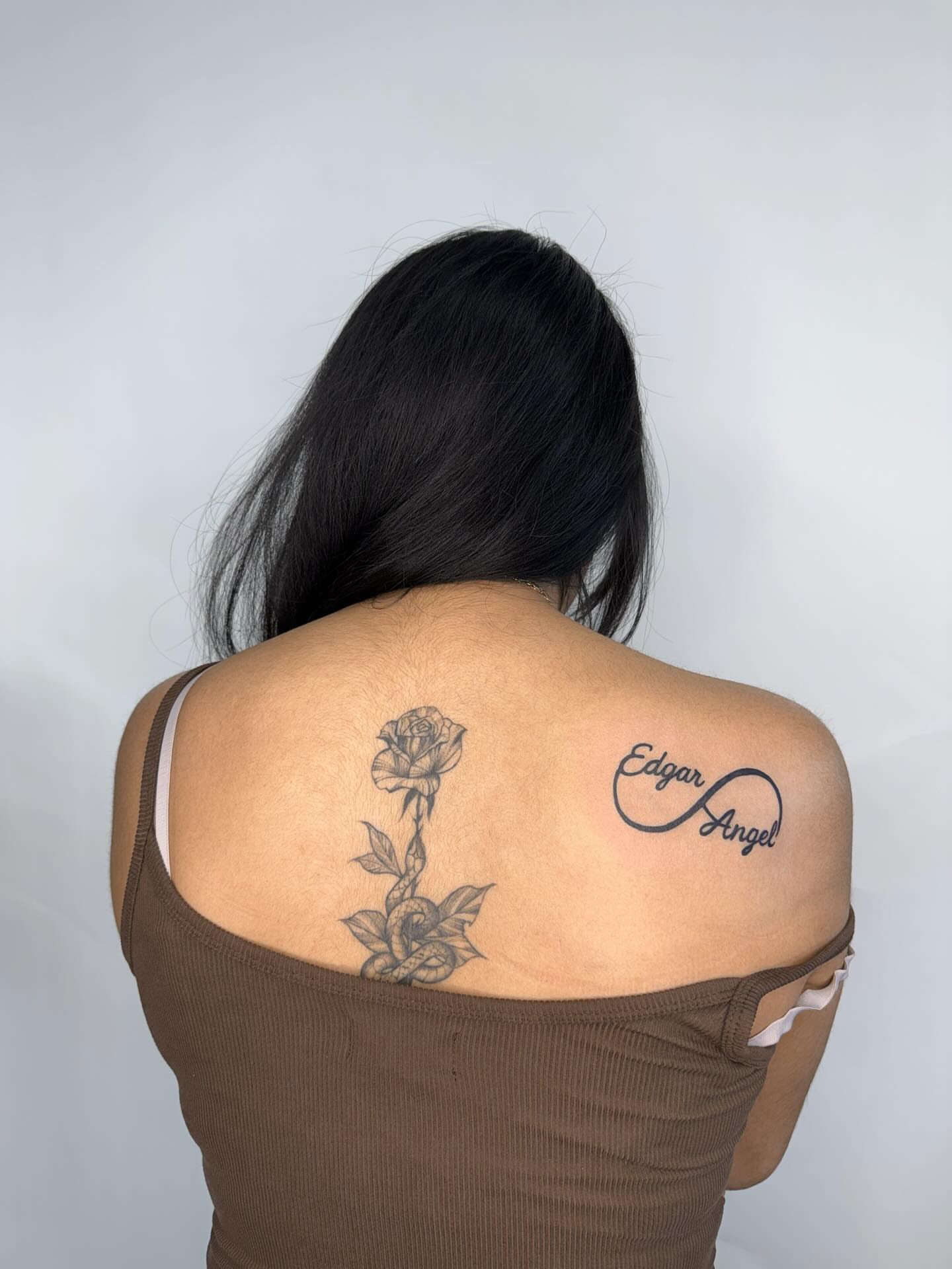 Rose and infinity symbol black and grey tattoo on the shoulder by Joey tattoo