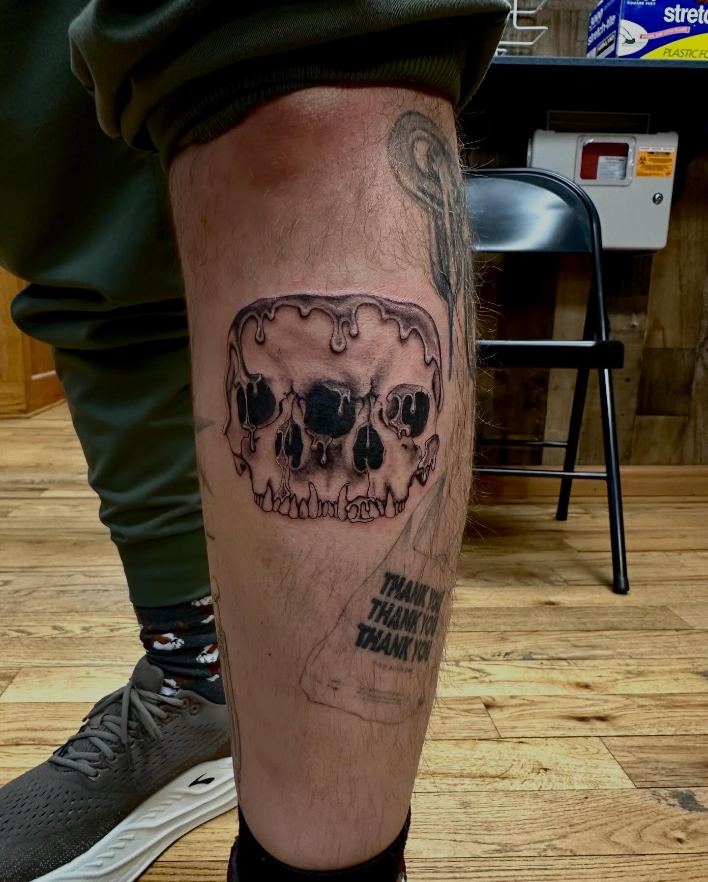 Melting skull dark realism tattoo on the calf by Marie Novotny, Lakewood, Ohio