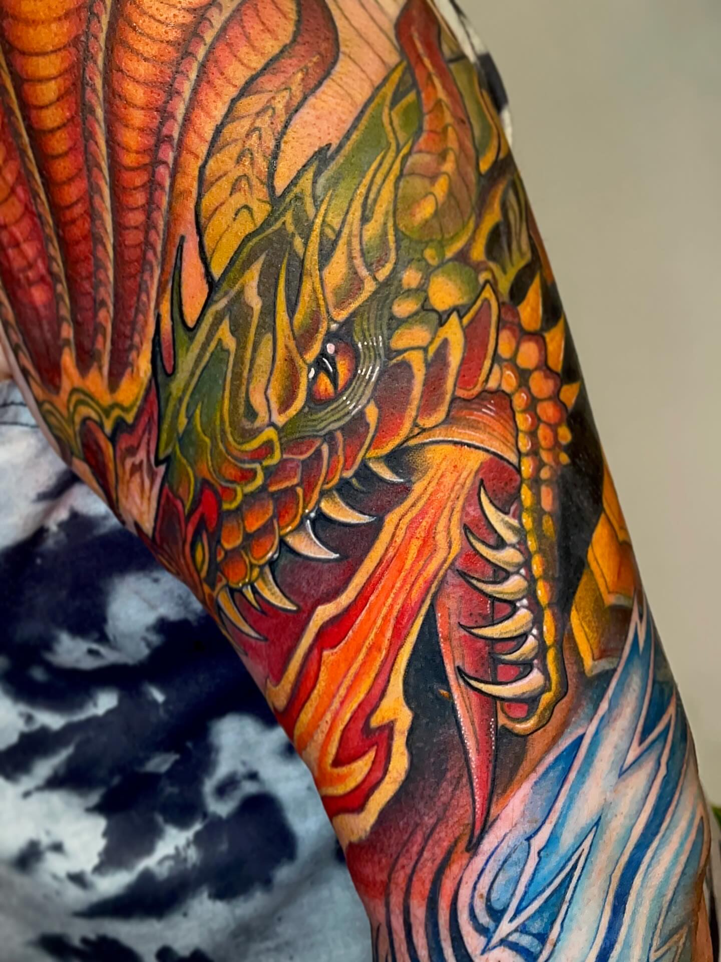 Dragon new school tattoo on the forearm by Samantha Castrovinci, Durham, North Carolina