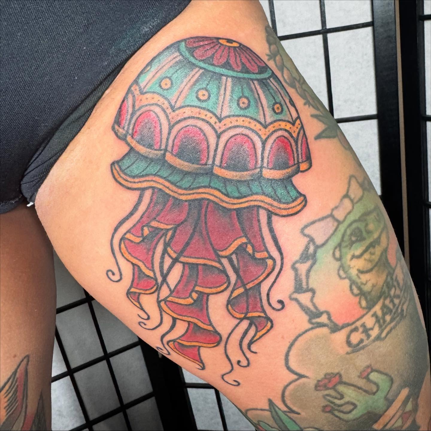 Jellyfish American traditional tattoo on the thigh by Justina🪐