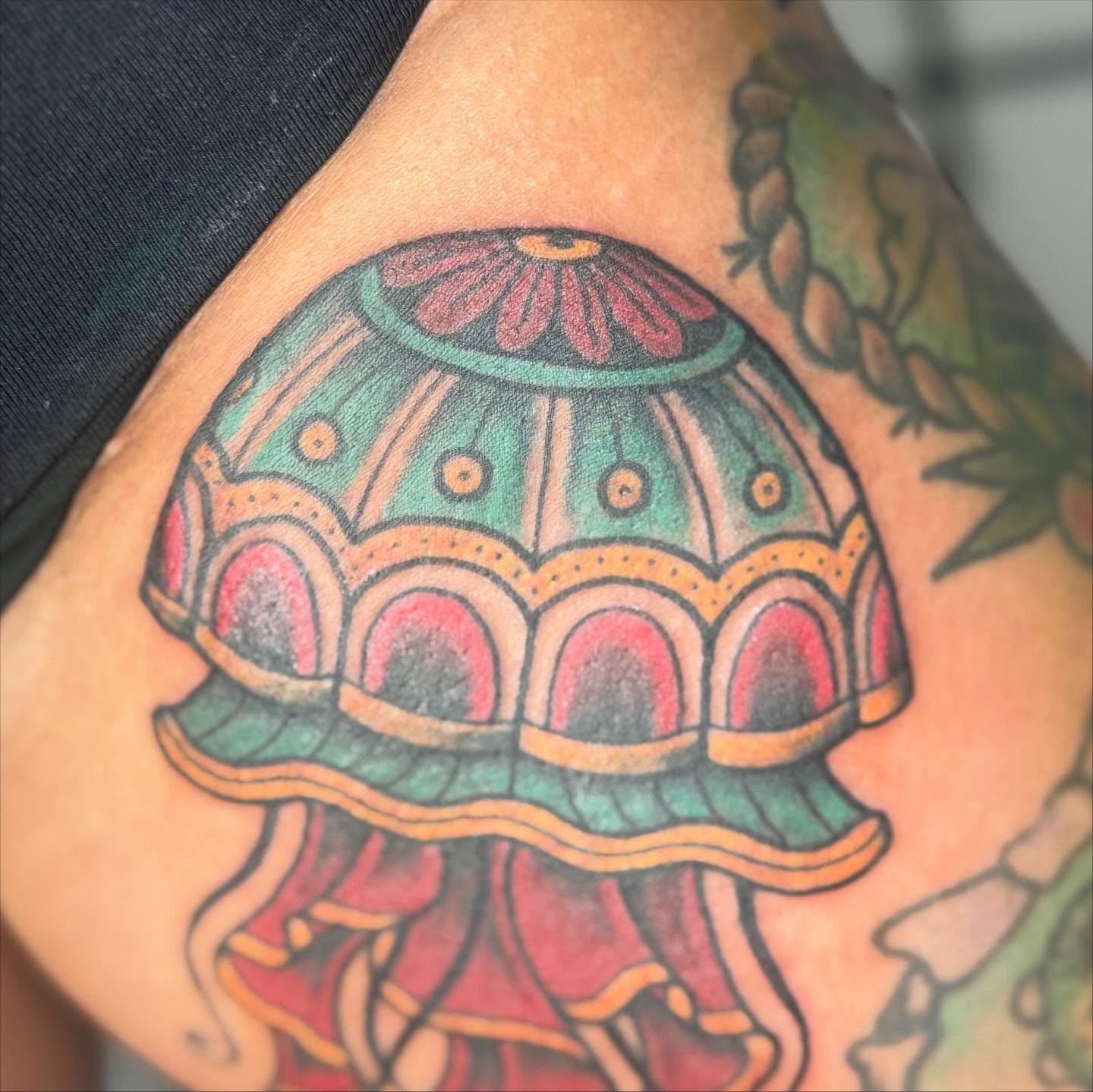 Jellyfish new school tattoo on the upper arm by Justina🪐