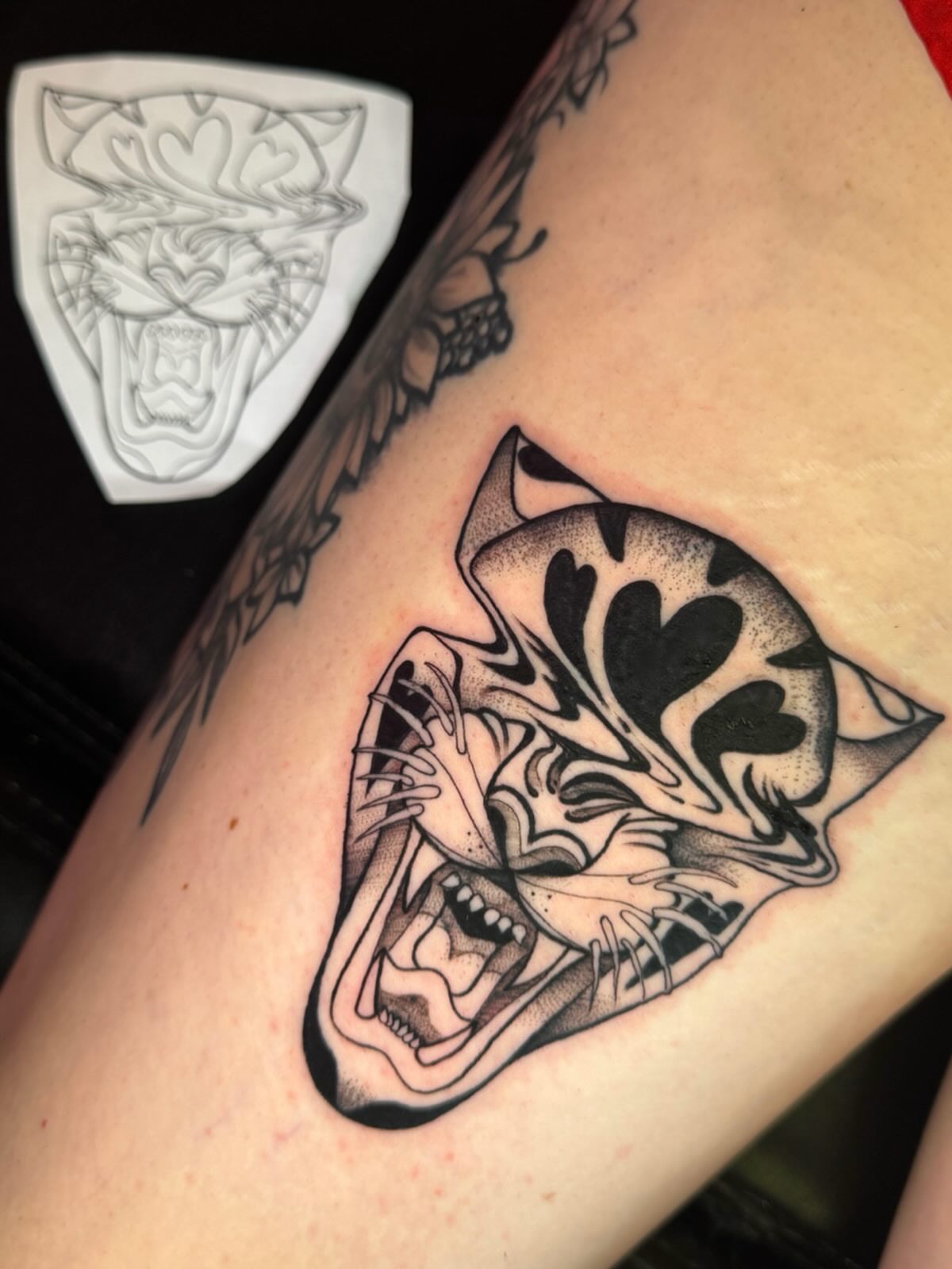 Angry tiger black and grey tattoo on the forearm by Kayla Rosencrans