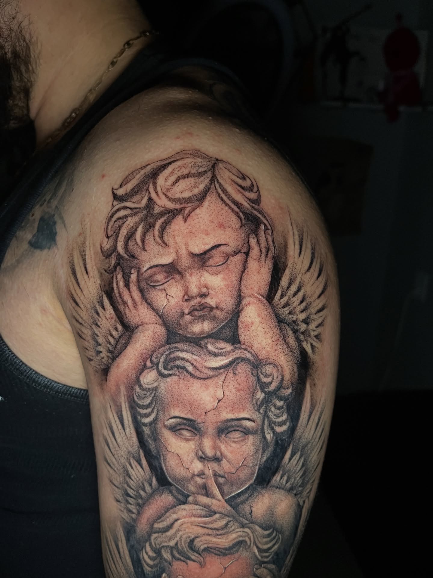 Angels realism tattoo on the shoulder by Dotwork
