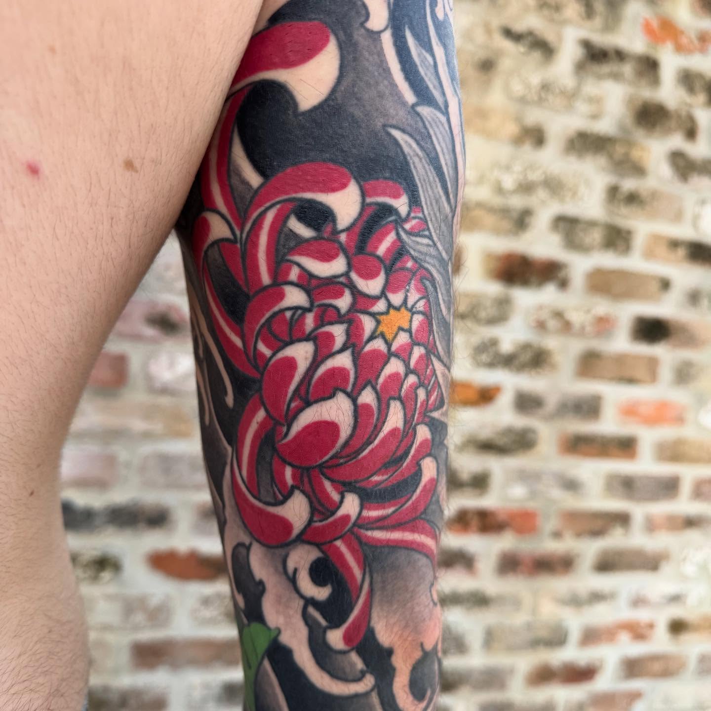 Chrysanthemum japanese irezumi tattoo on the forearm by Jeremy Justice, New Orleans, Louisiana