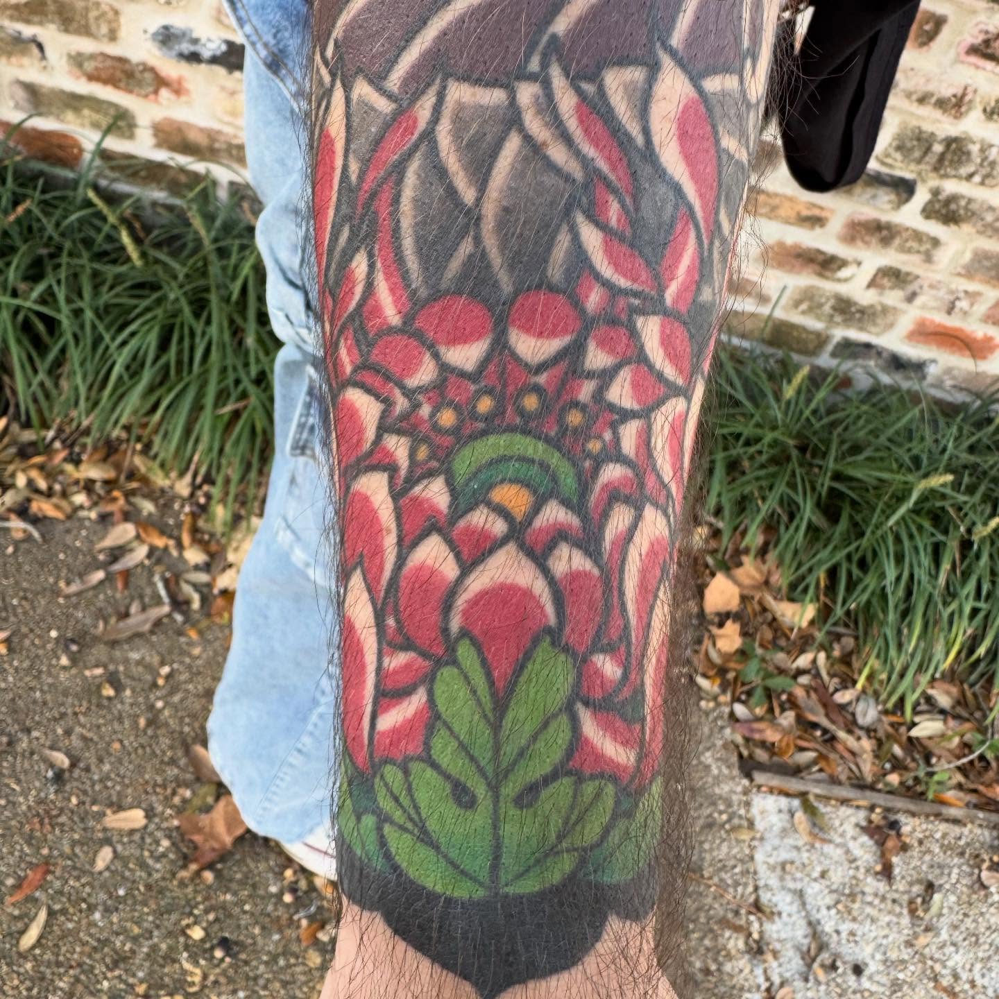 Lotus flower American traditional tattoo on the forearm by Jeremy Justice, New Orleans, Louisiana