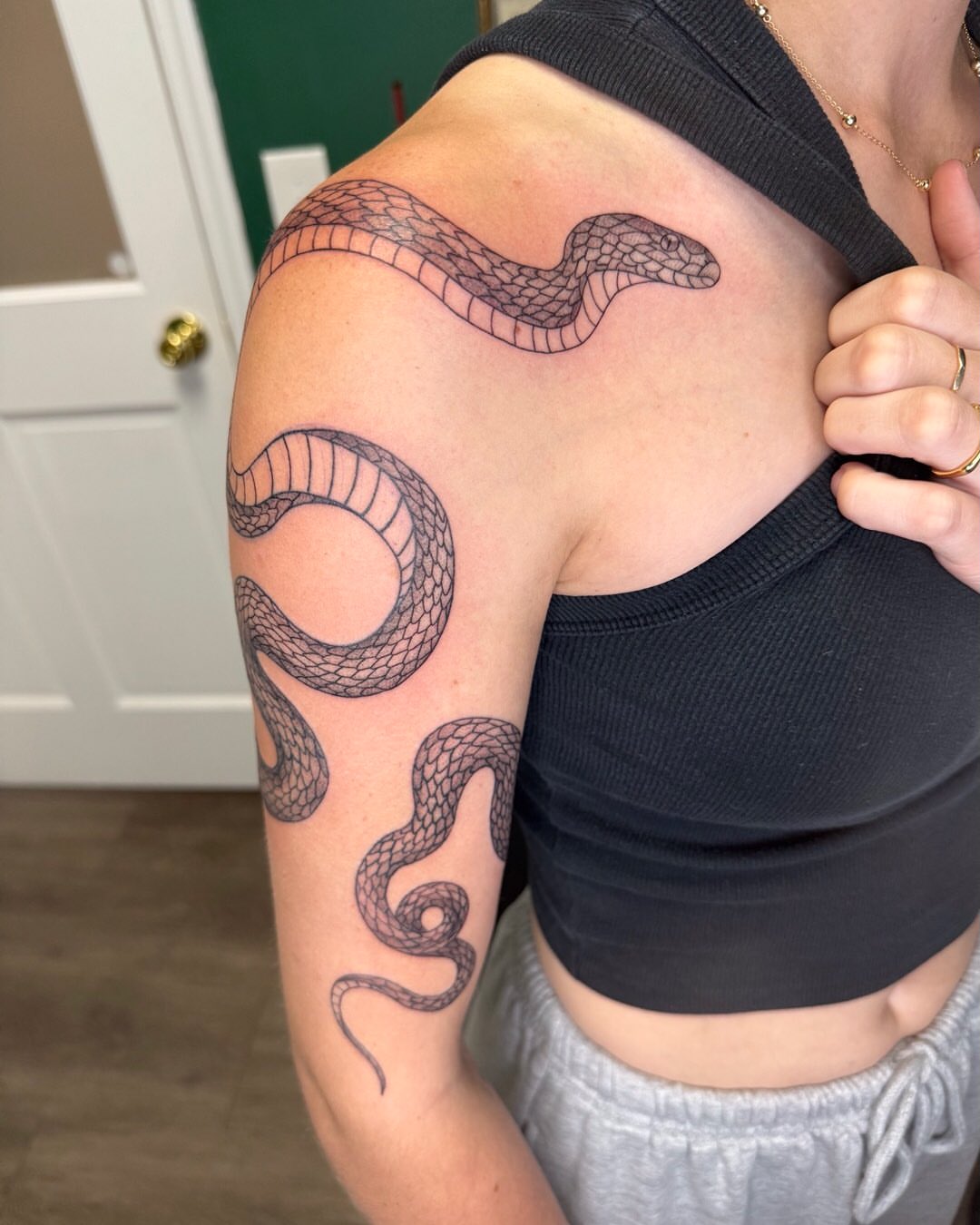 Snake black and grey tattoo on the shoulder by Cortnie, Nashville, Tennessee