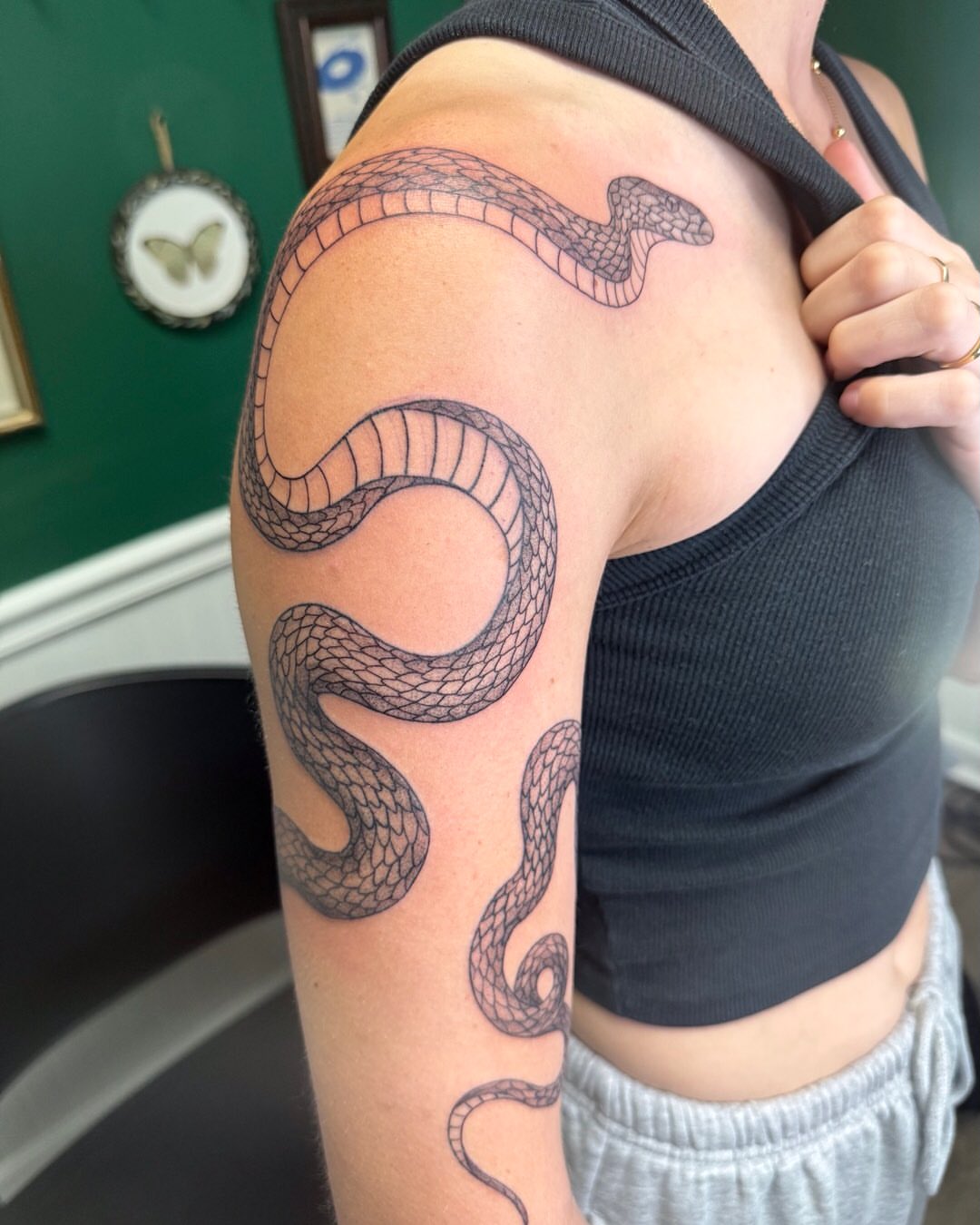 Snake black and grey tattoo on the upper arm by Cortnie, Nashville, Tennessee