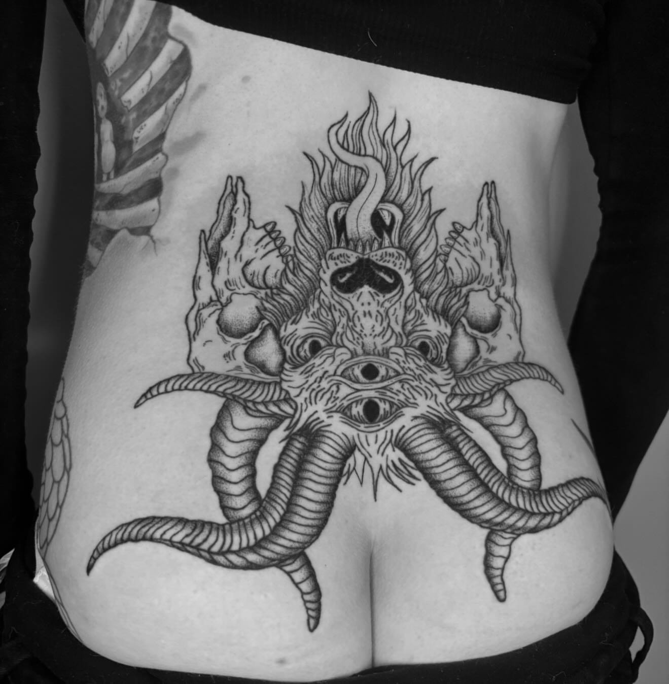 Demon skull dark realism tattoo on the ribs by Bryan Black