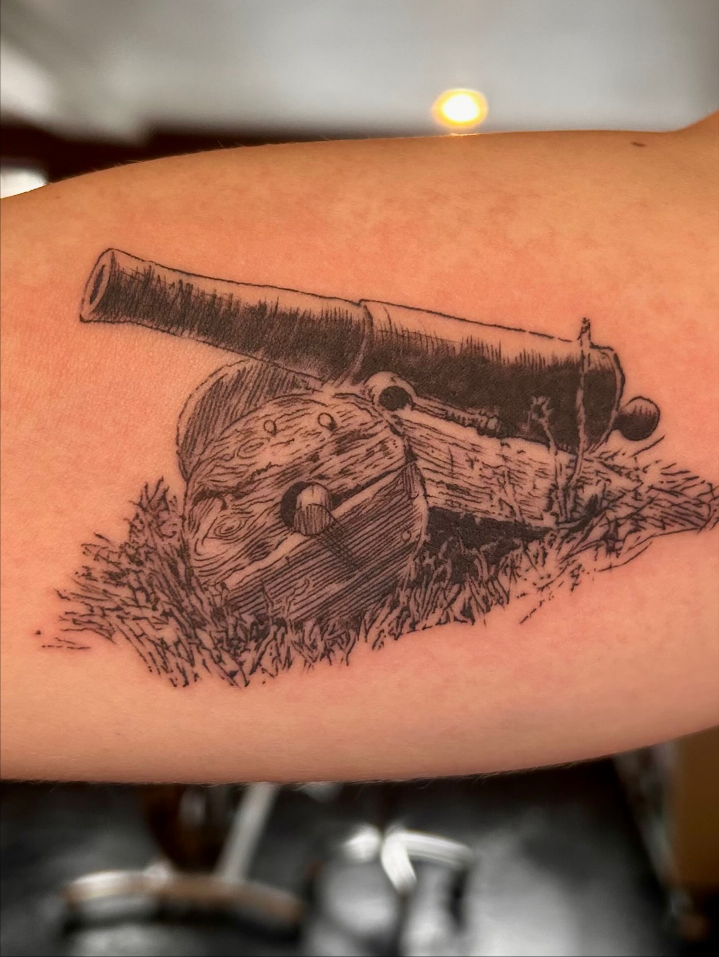 Cannon black and grey tattoo on the forearm by King By Trade 👑