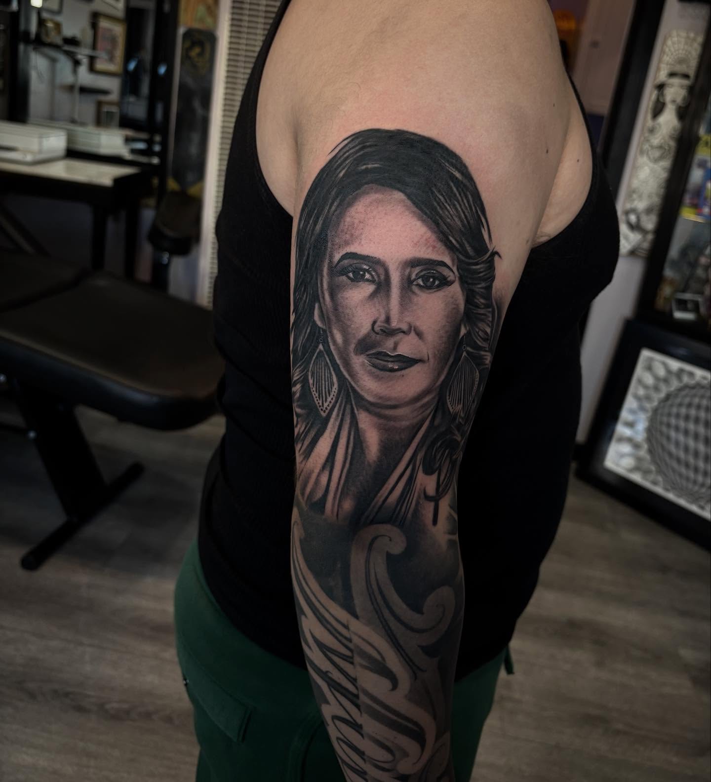 Portrait realism tattoo on the forearm by michael