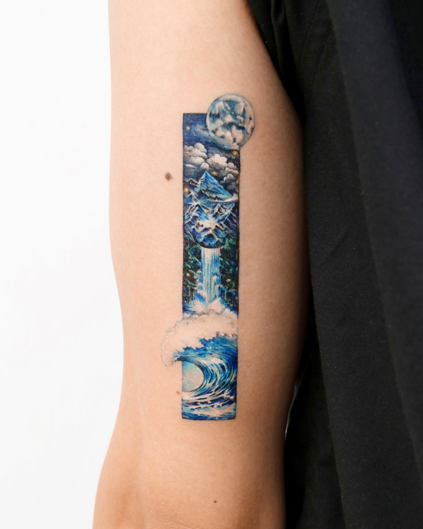 Landscape realism tattoo on the forearm by YUN