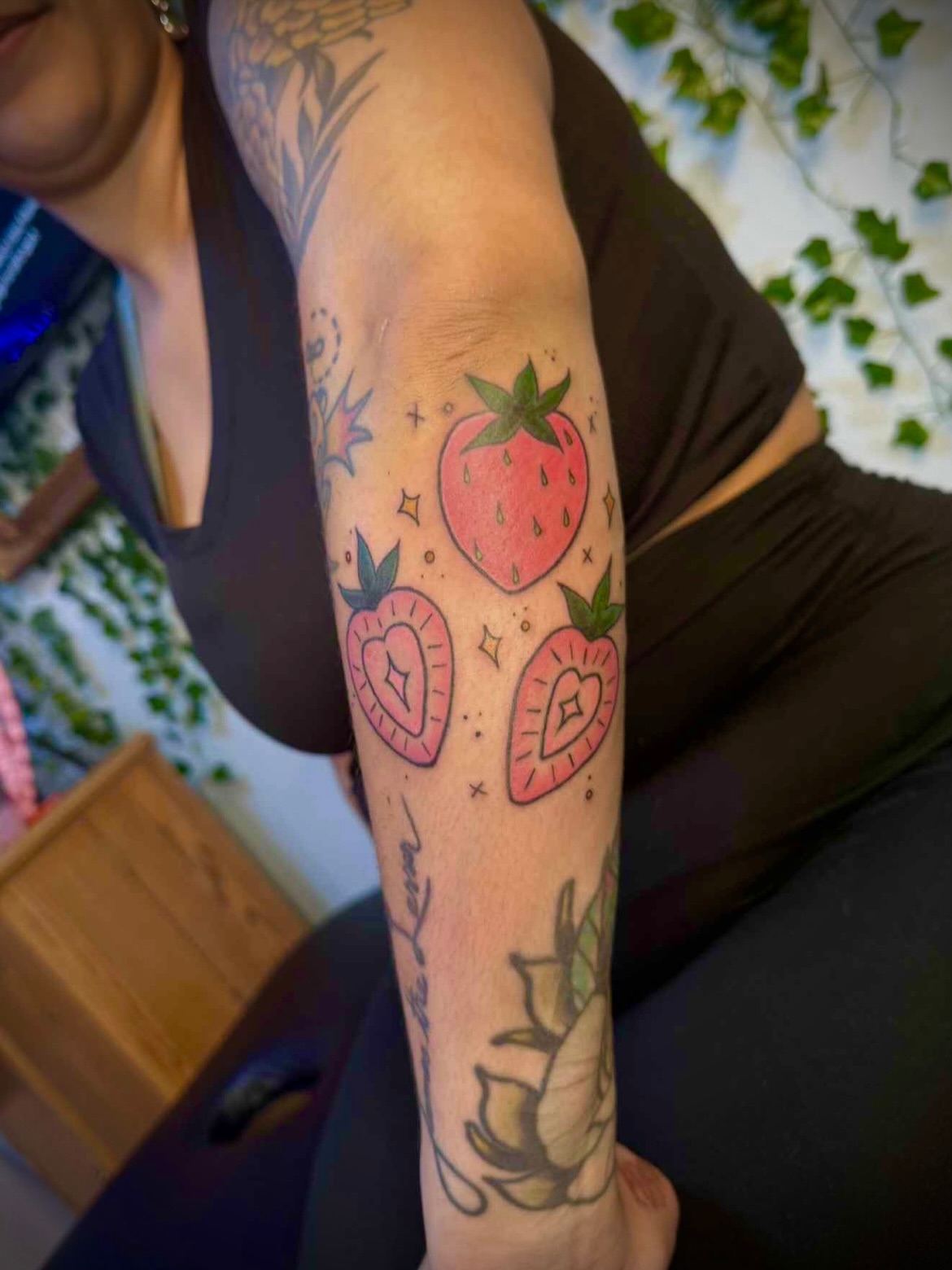 Strawberries dotwork tattoo on the forearm by Kiersten Tickle