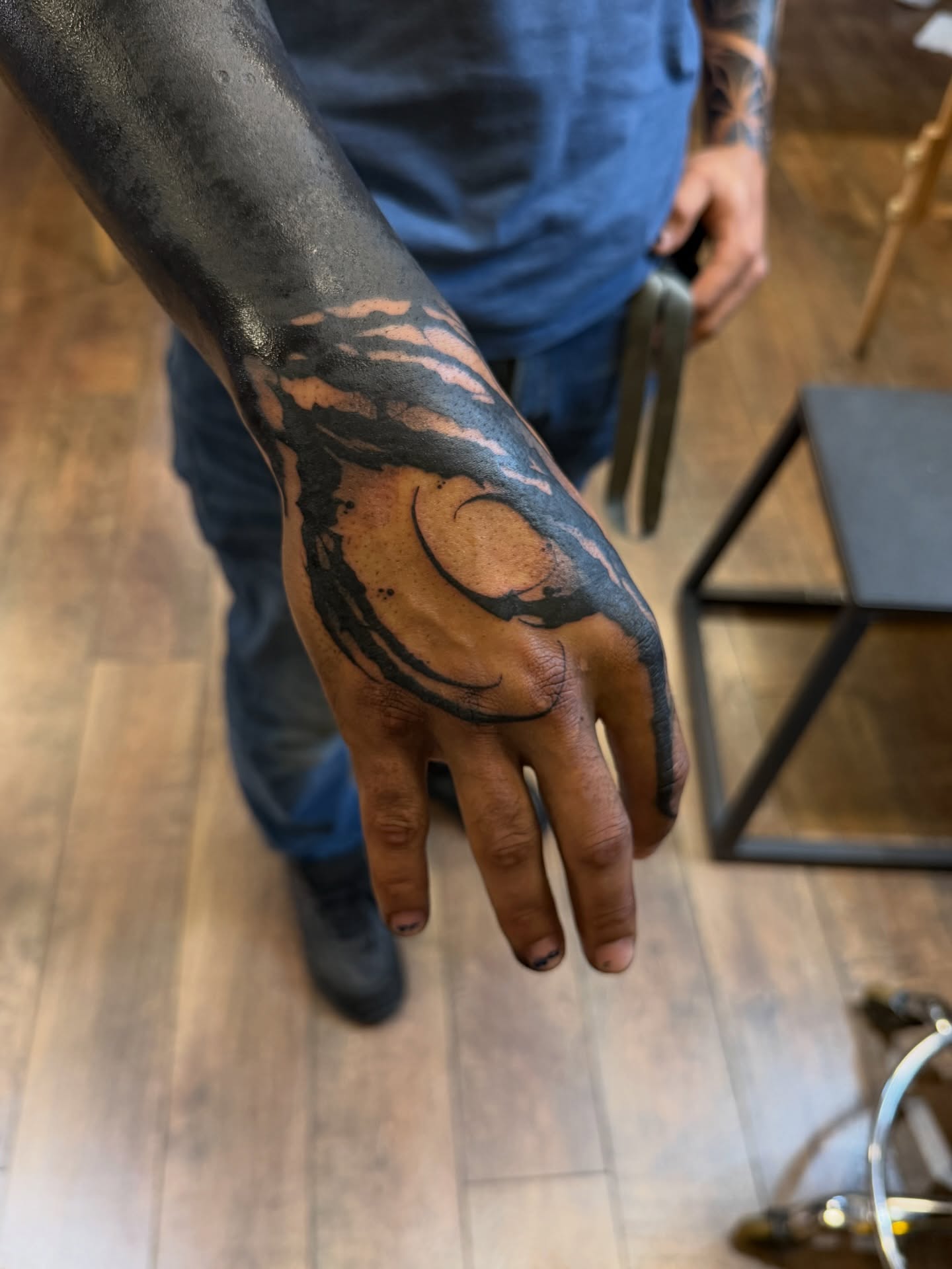 Tribal swirl tribal tattoo on the hand by Denver Blackout Tattoo Specialist - Anthony