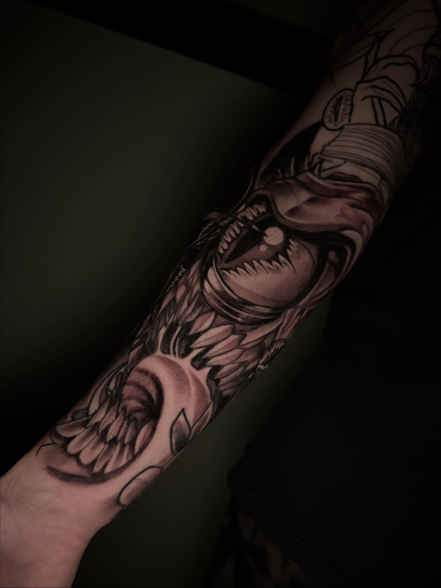Demon black and grey tattoo on the forearm by Javier Rivera