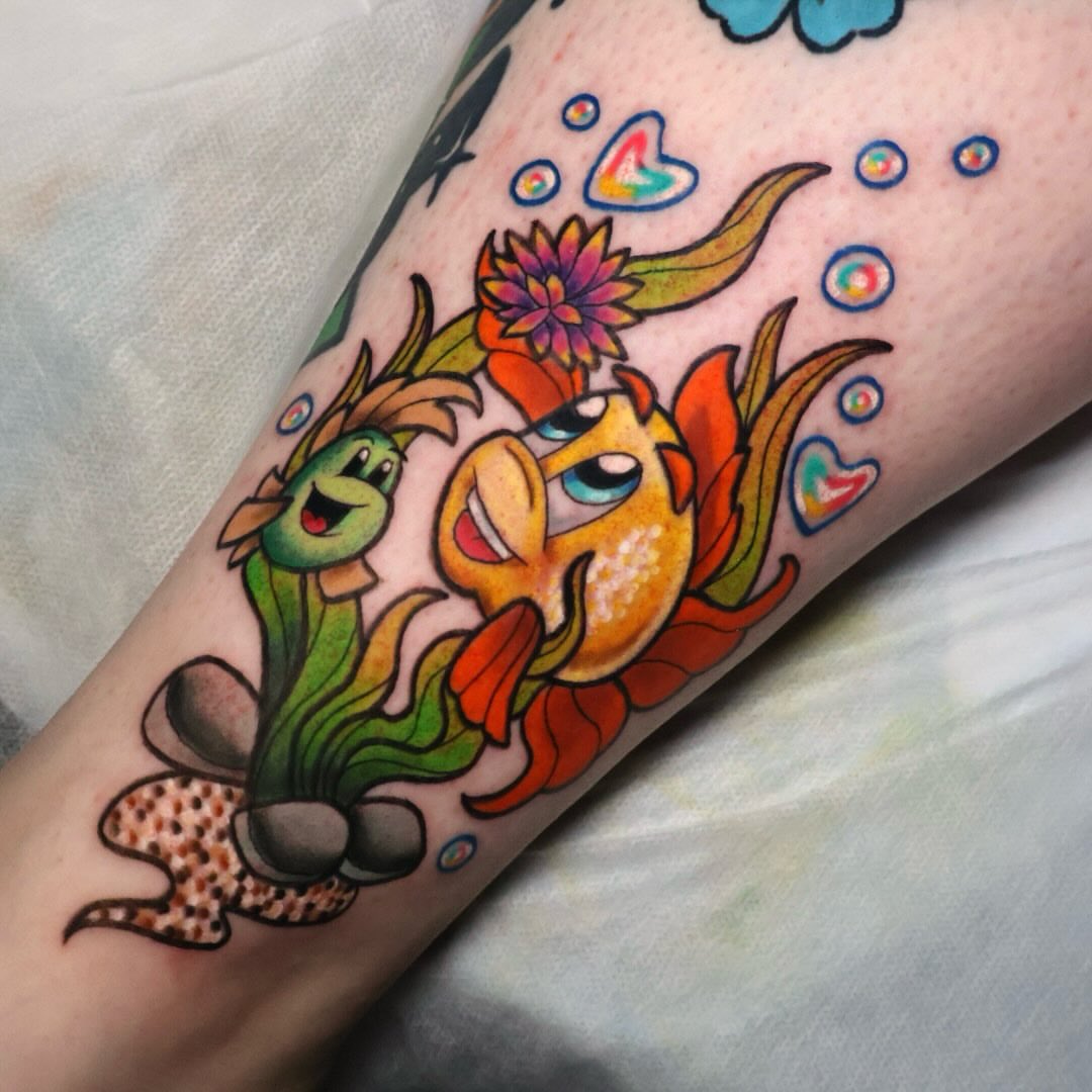 Fish and plant new school tattoo on the forearm by Bailey Drey