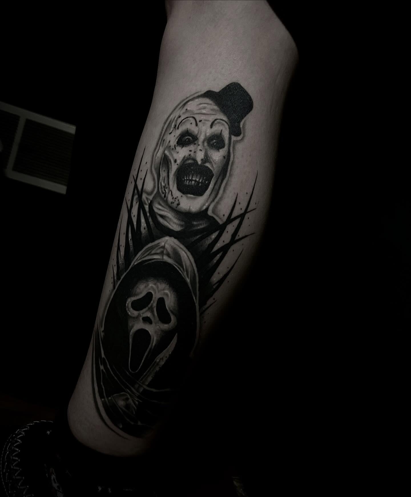 Clown and scream mask realism tattoo on the forearm by Heaven Arianna