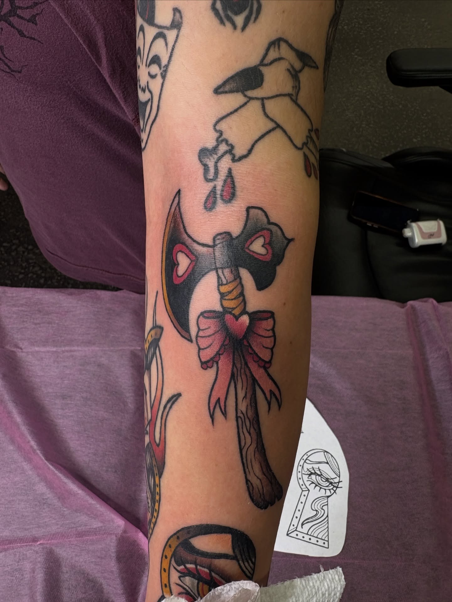 Axe with ribbon American traditional tattoo on the forearm by ✩ 🕯️☾༺♰ gracey ༻☽🕯️✩