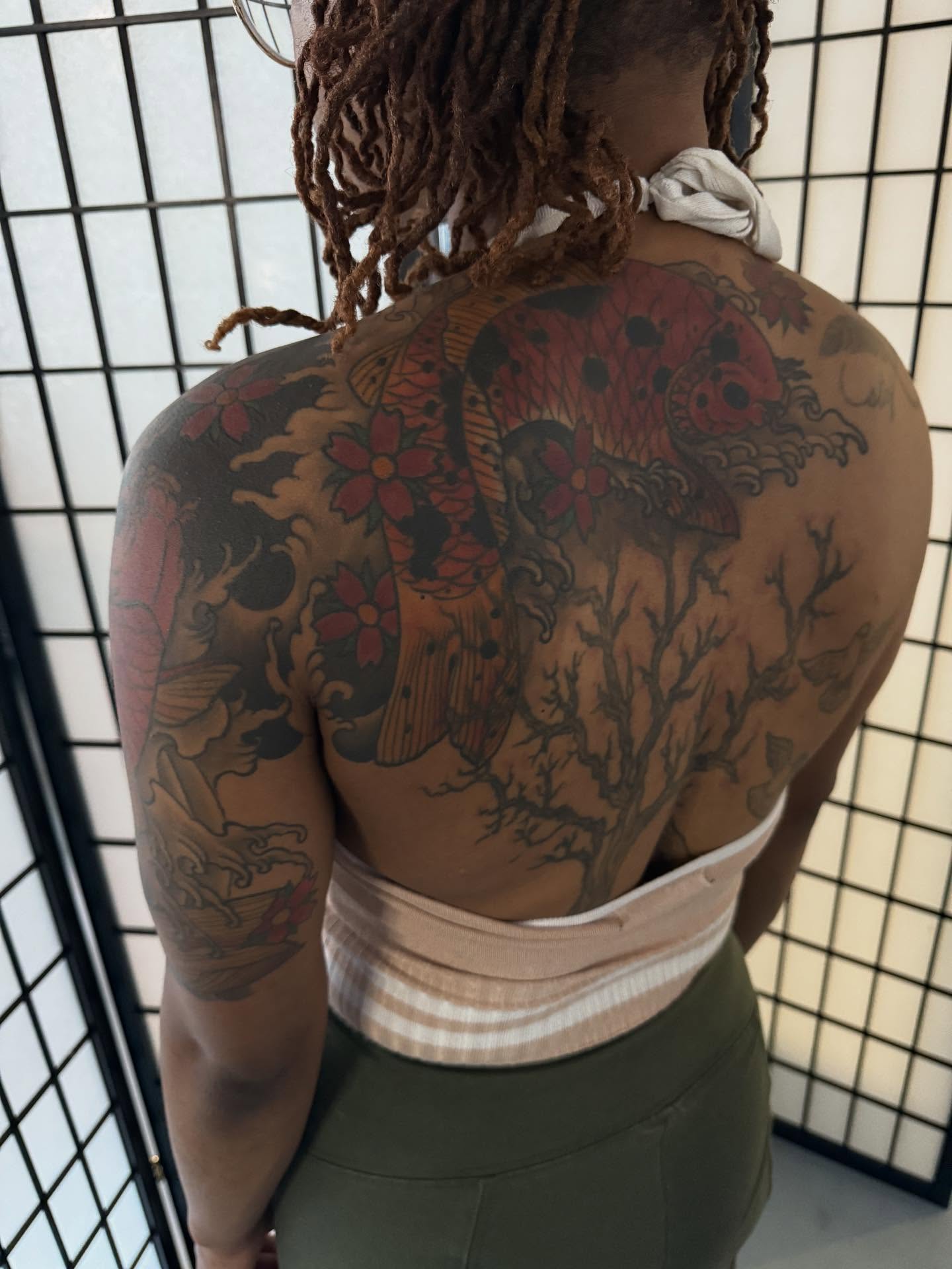 Koi fish and cherry blossoms japanese irezumi tattoo on the back by Randall Croley El
