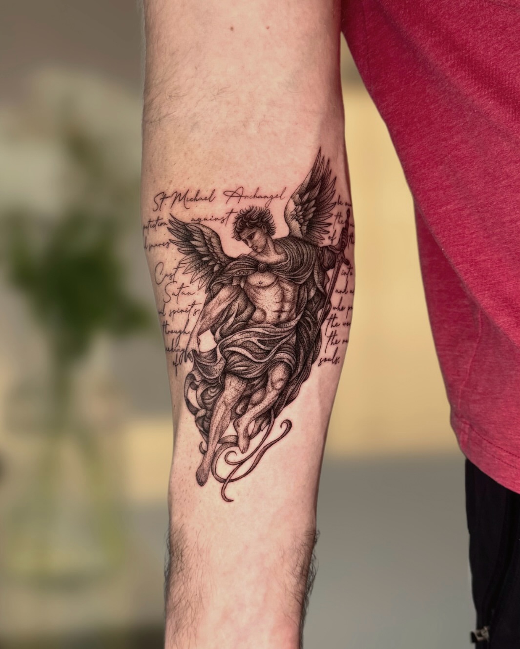 Angel black and grey tattoo on the forearm by Ingrid Rojas