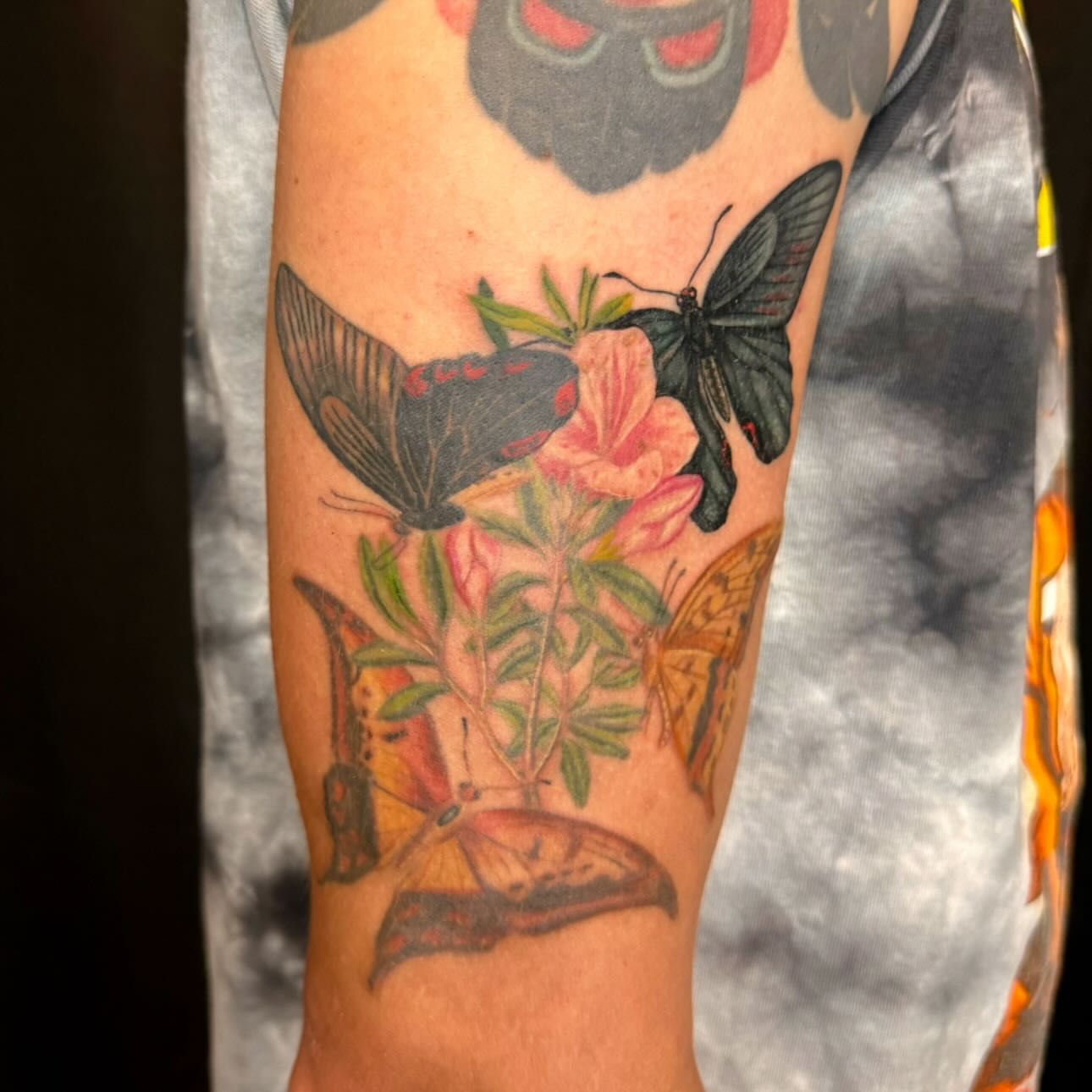 Butterflies and flowers realism tattoo on the forearm by Enda 🧚🏻‍♀️