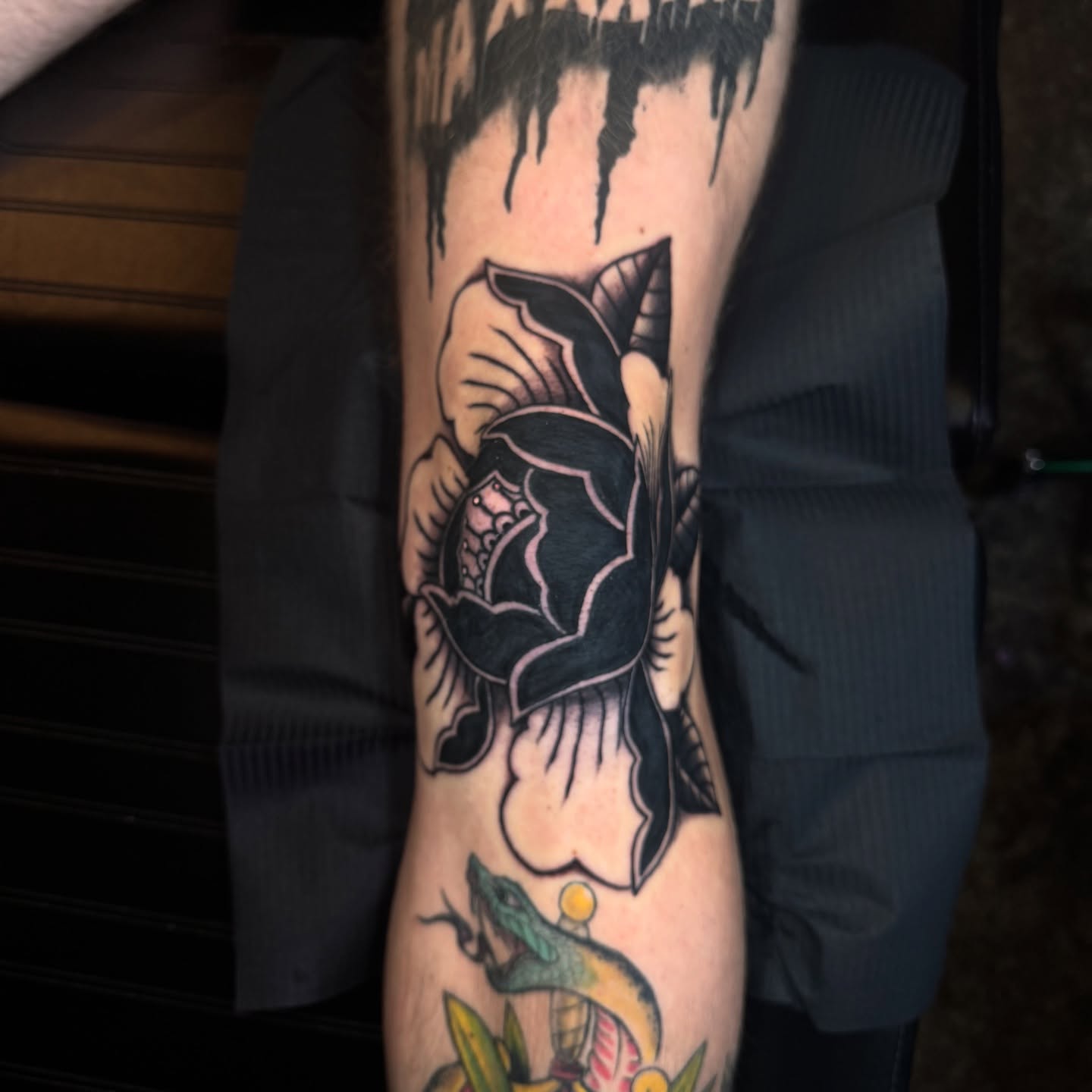 Rose American traditional tattoo on the forearm by Sideshow Danny