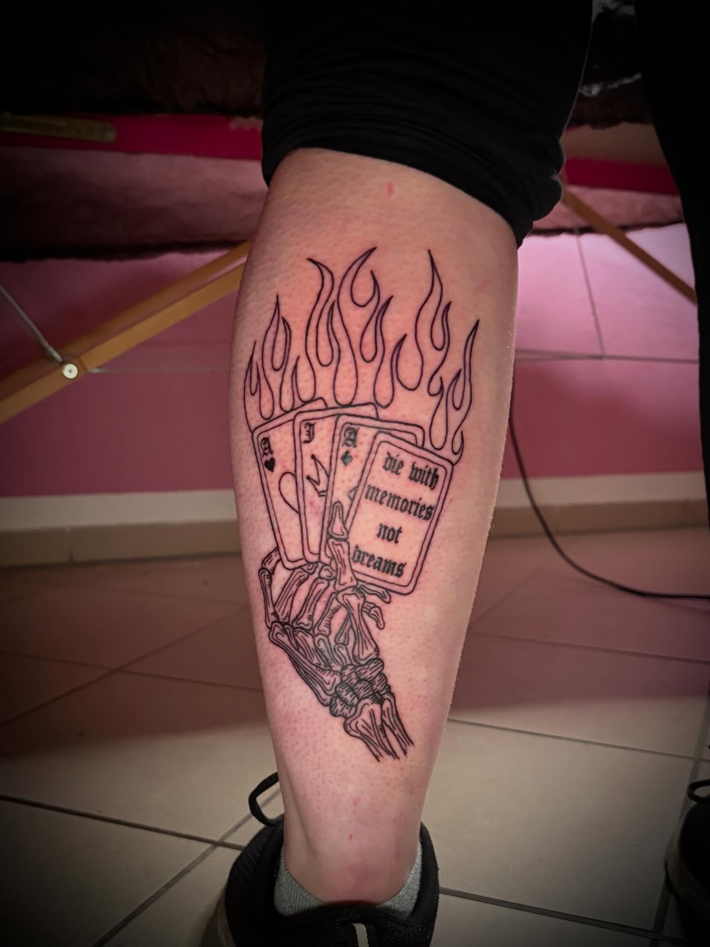 Playing cards and flame black and grey tattoo on the calf by lu ๐