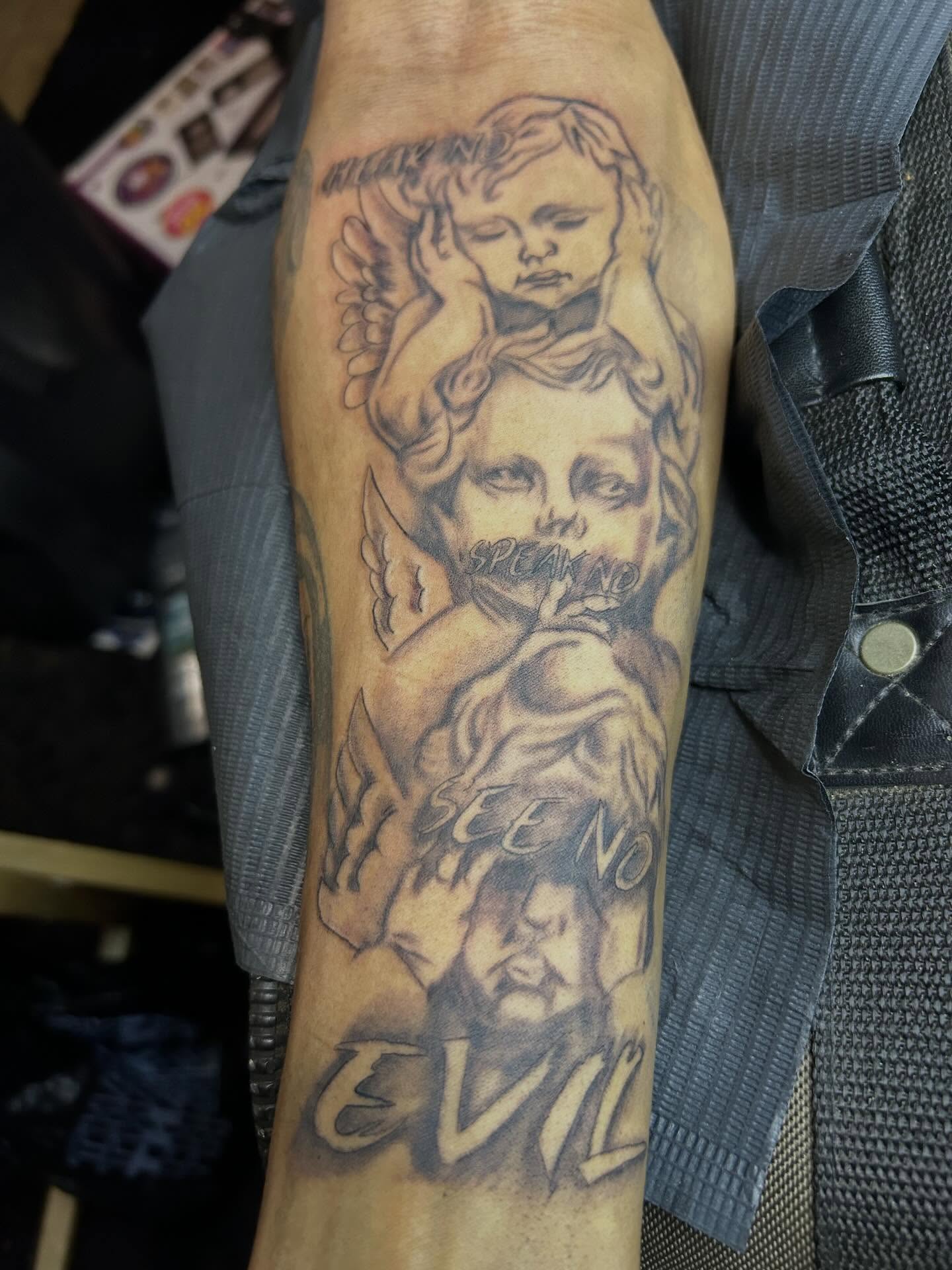 See no evil black and grey tattoo on the forearm by Detroit tattoo Artist
