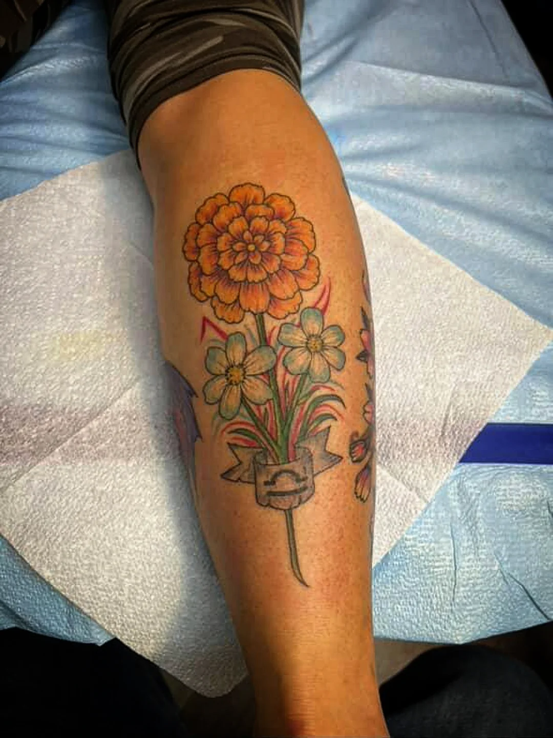 Flower bouquet American traditional tattoo on the forearm by Josh Sroga