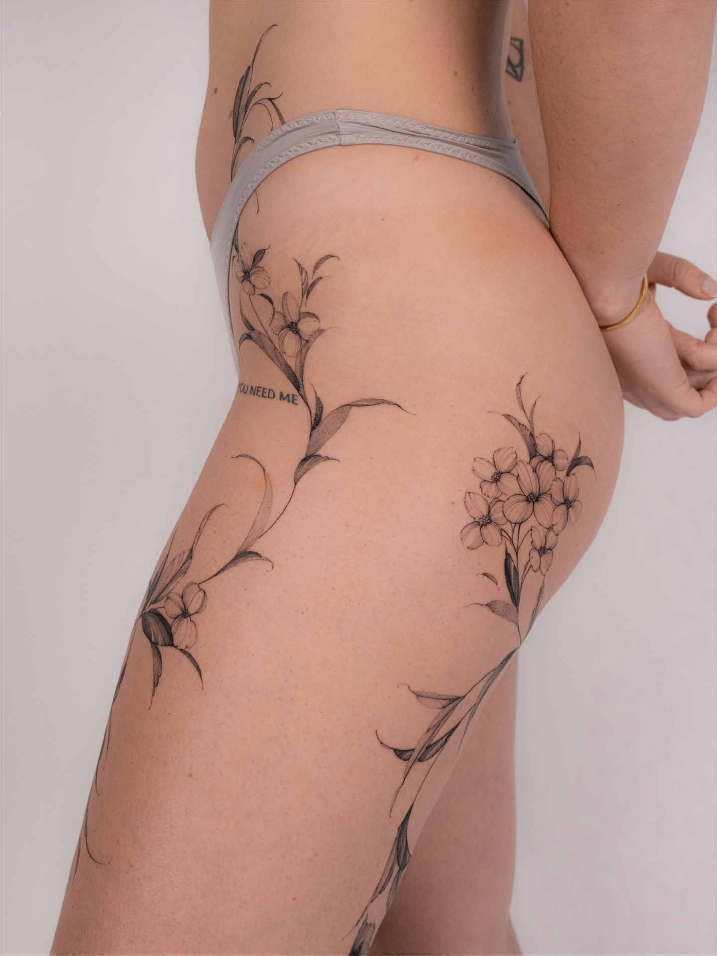 Floral design black and grey tattoo on the thigh by i flower you
