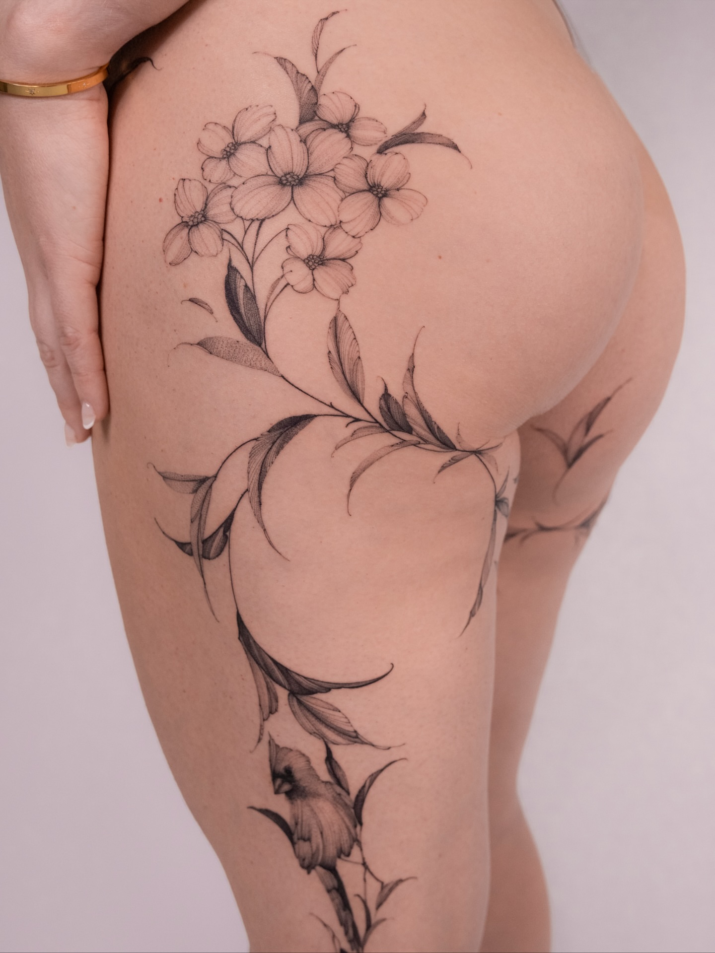 Flower bouquet black and grey tattoo on the thigh by i flower you