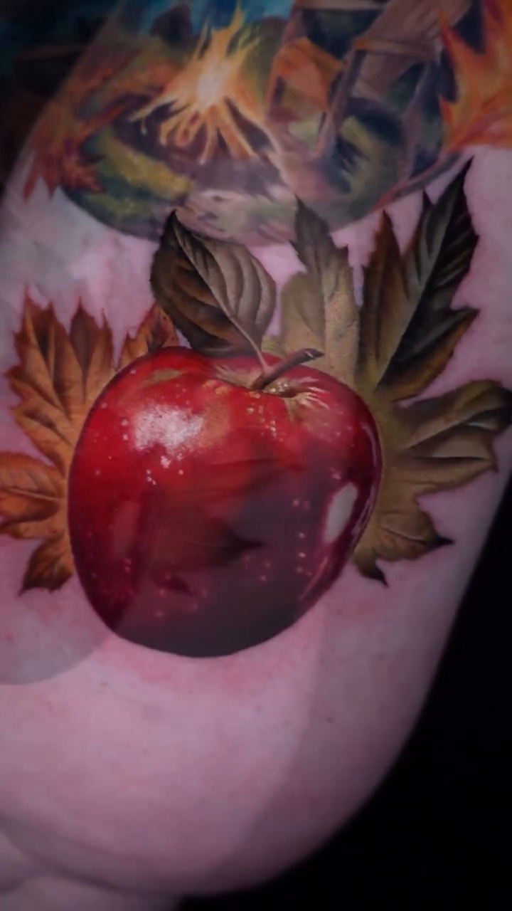 Apple and autumn leaves realism tattoo by color realism tattoos by gela✨