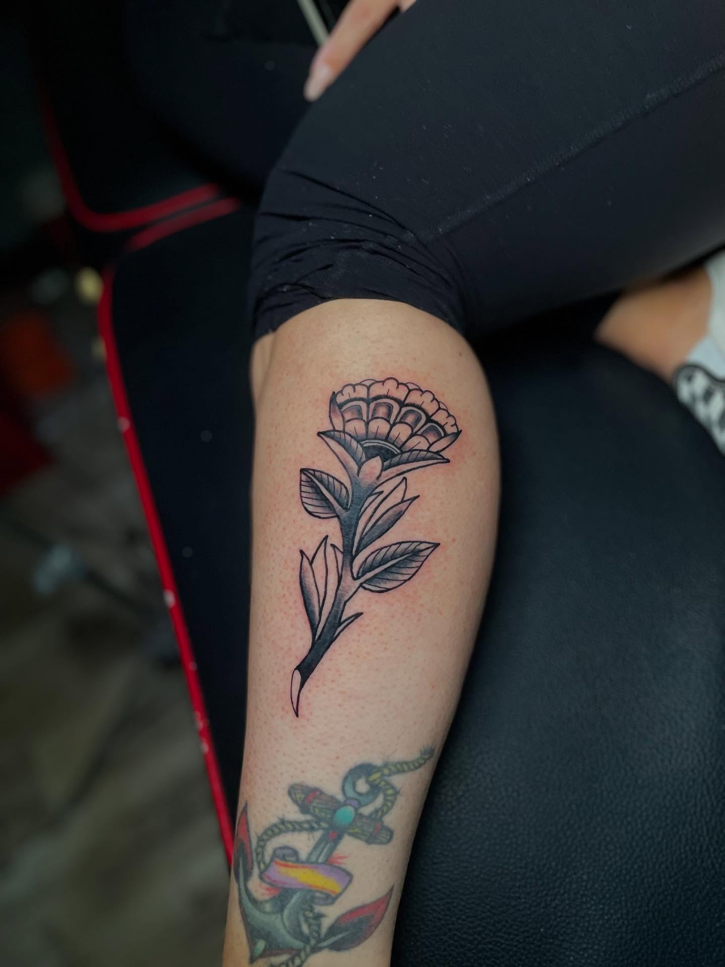 Flower black and grey tattoo on the thigh by Mark Johnson [Tattoo Artist]