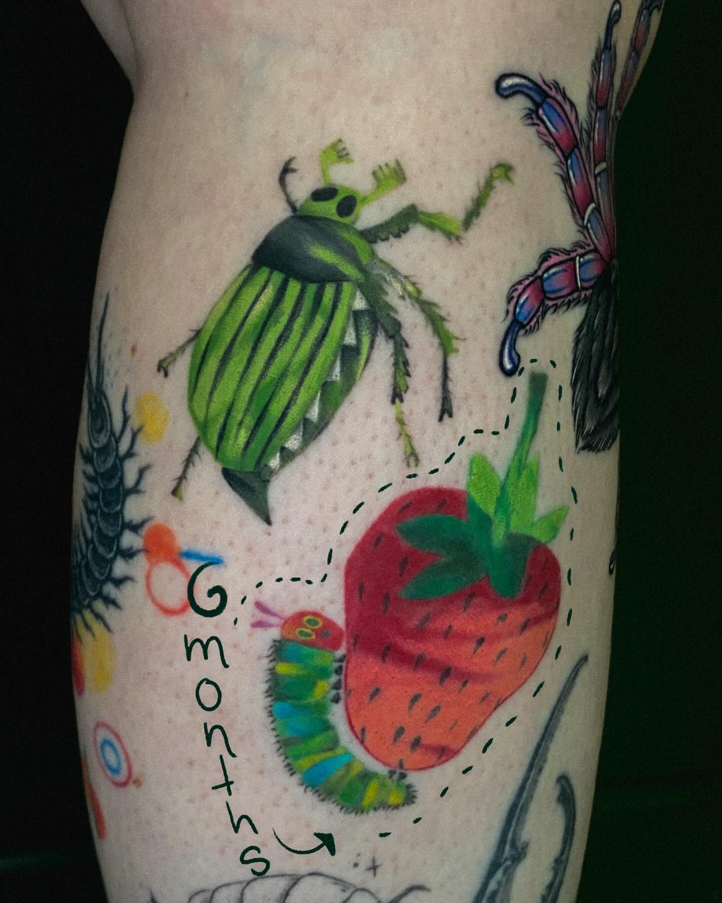 Insects and strawberry new school tattoo on the forearm by Autumn