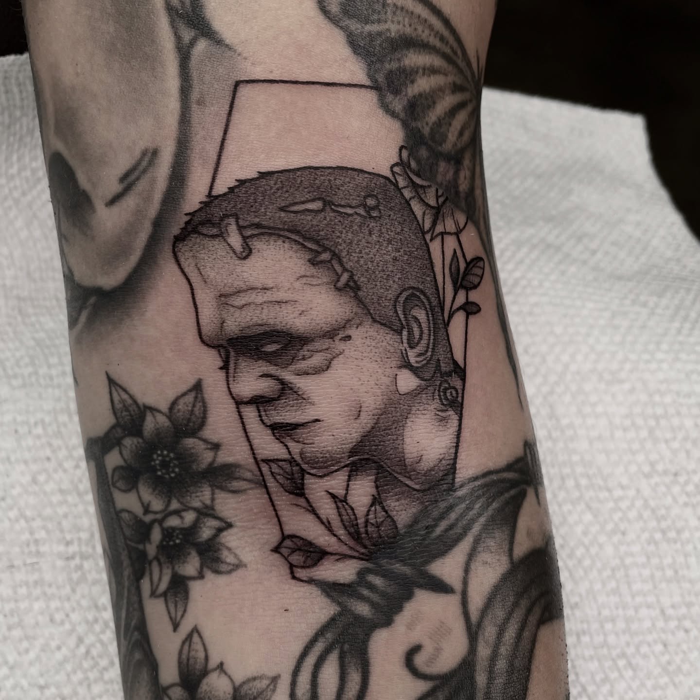 Frankenstein realism tattoo on the forearm by Ducky