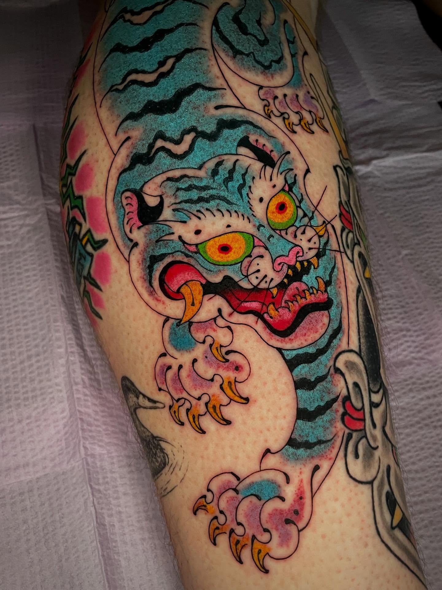 Tiger American traditional tattoo on the forearm by Bryan Ortega