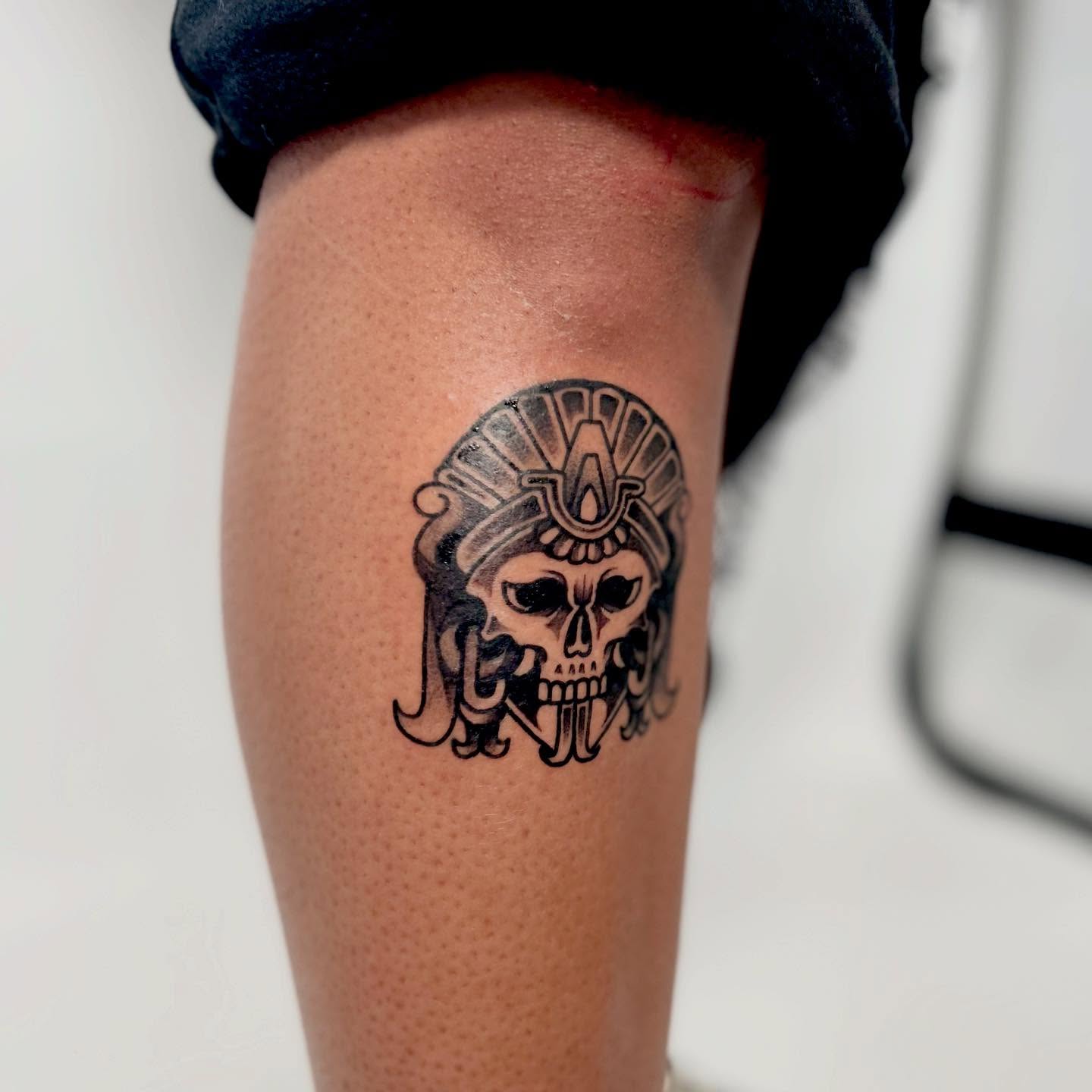 Skull with headdress black and grey tattoo on the forearm by Lip™