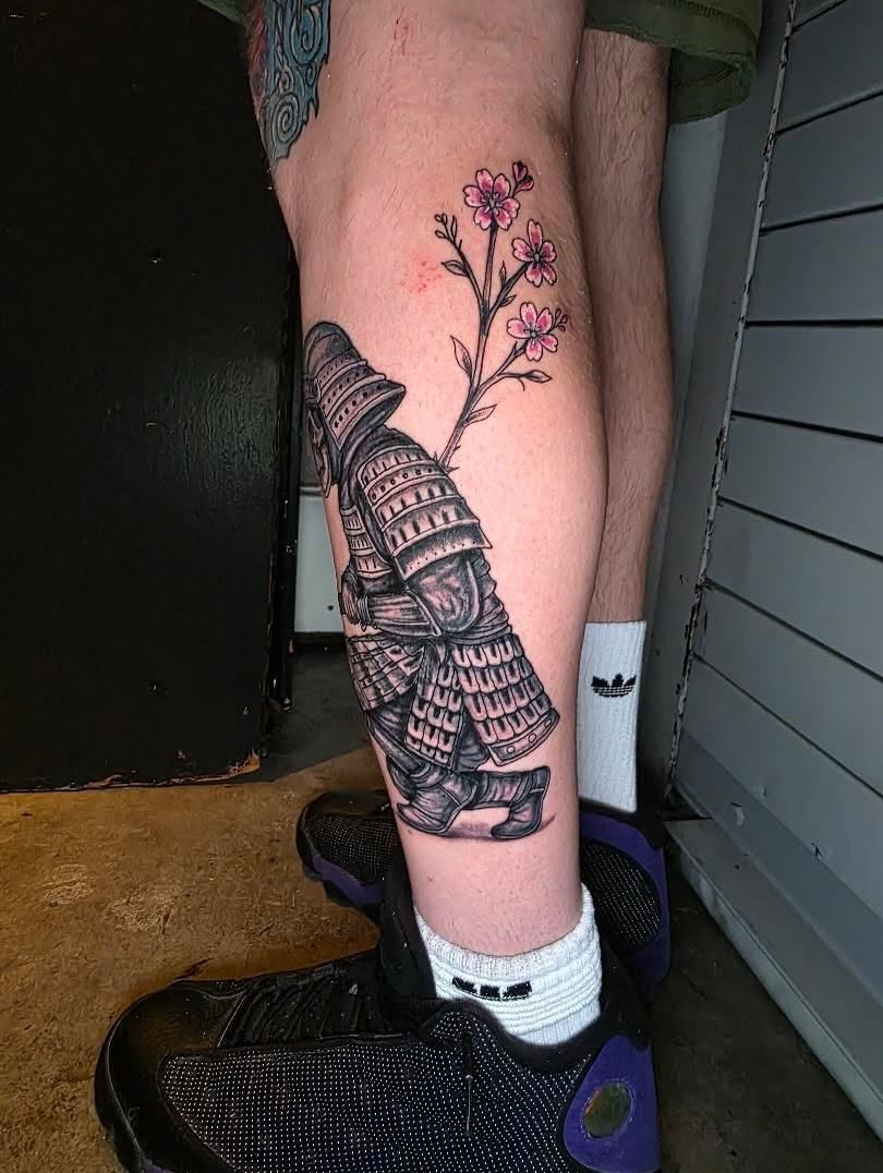 Samurai armor and cherry blossoms japanese irezumi tattoo on the calf by Dylan Fowler