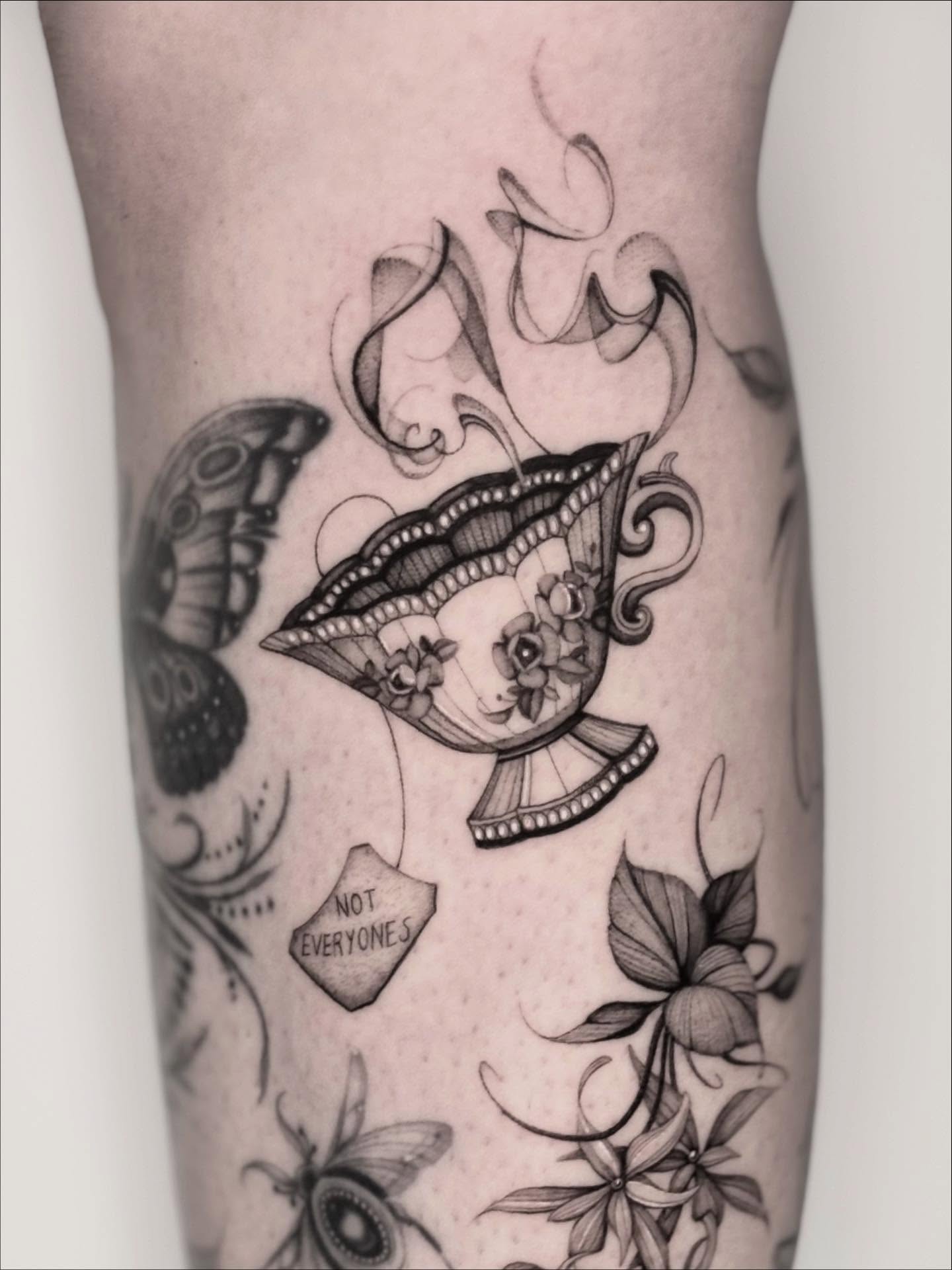Lips and butterfly dotwork tattoo on the forearm by Brittney Naami, San Francisco, California