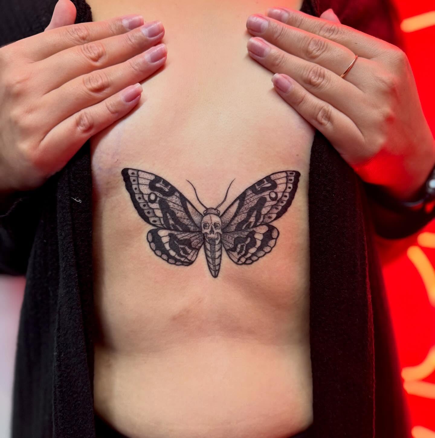 Butterfly black and grey tattoo on the chest by Sasha “Sashimi” Shabasov