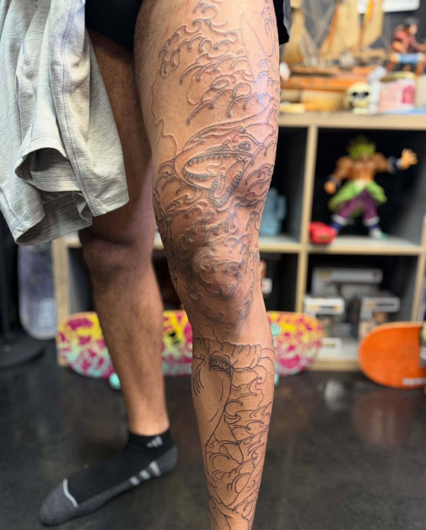 Dragon and waves japanese irezumi tattoo on the leg by Zack Yang, Houston, Texas