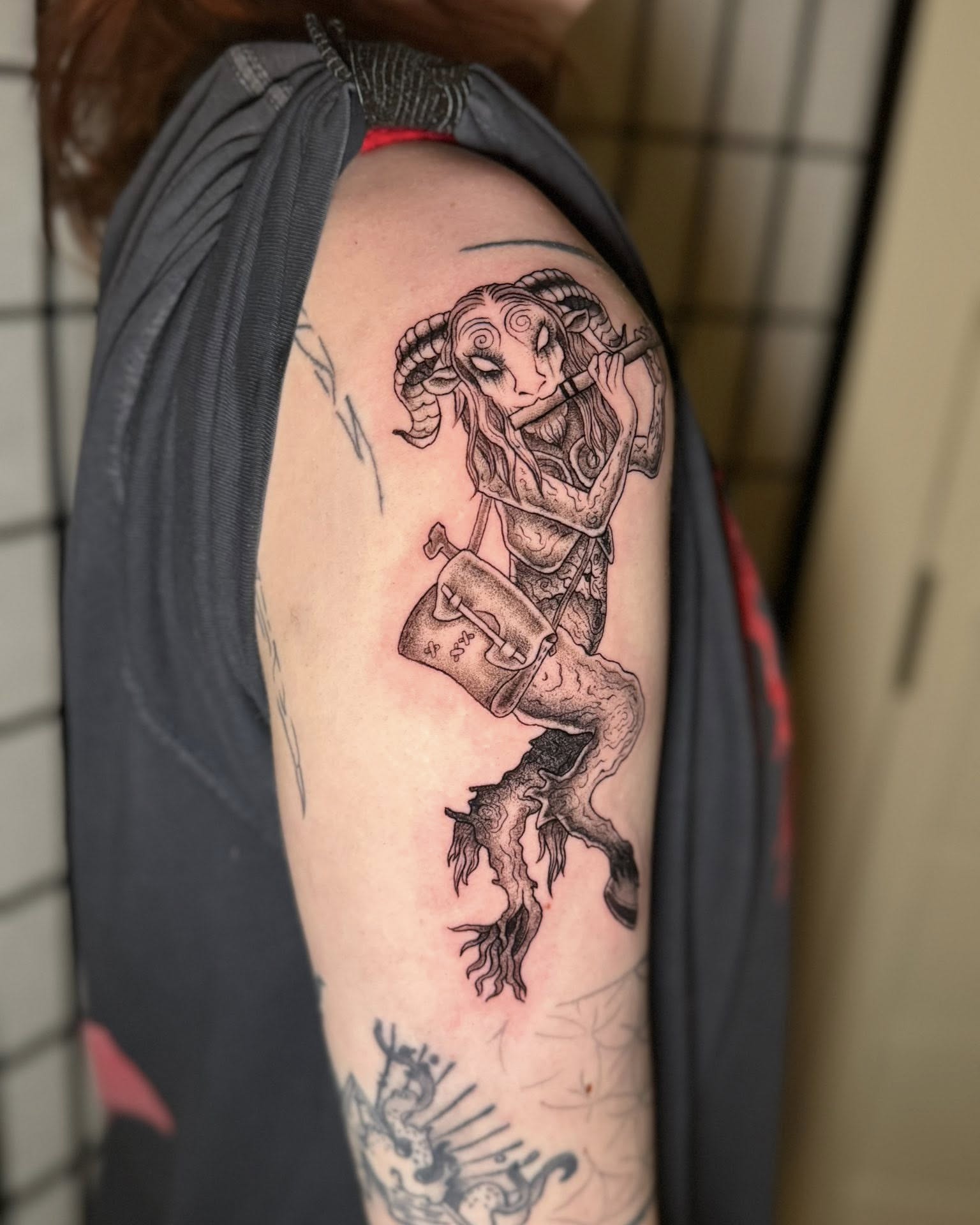 Goat-headed woman black and grey tattoo on the shoulder by Austin Poliszuk, Minneapolis, Minnesota