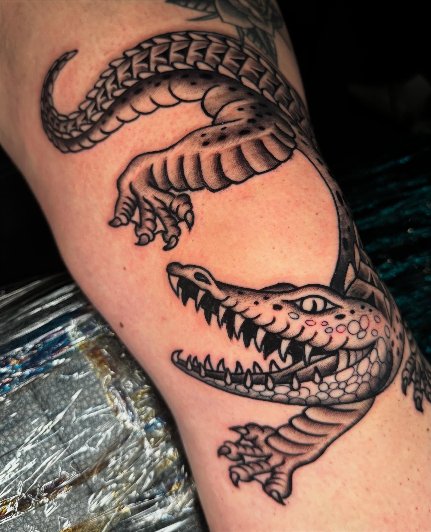 Alligator black and grey tattoo on the forearm by Graham Edward Vogel