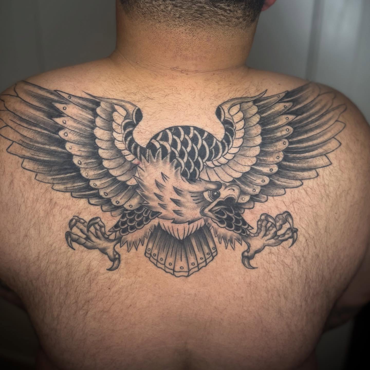 Eagle black and grey tattoo on the back by Matthew Crawley