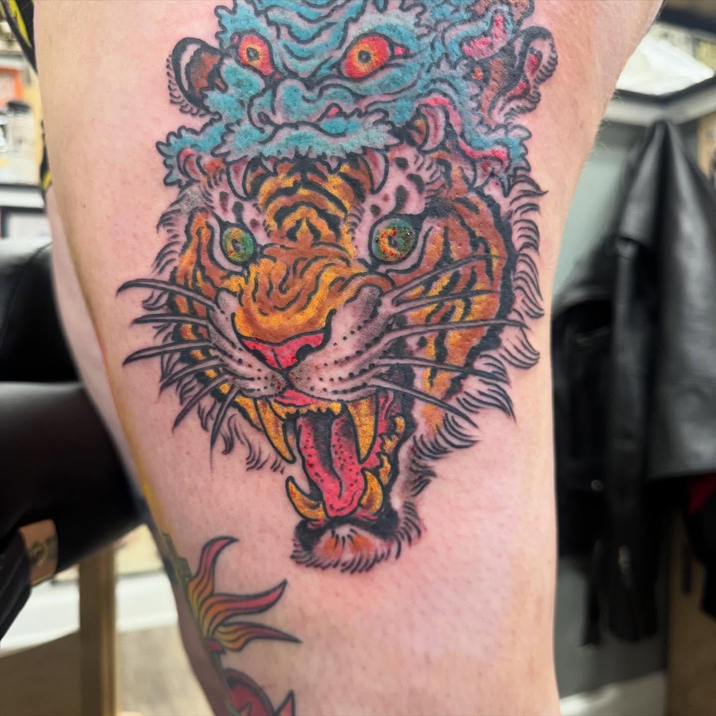Tiger American traditional tattoo on the thigh by Tim Lehi, Oakland, California